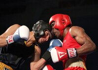 U.S. Marine Cpl. Damarias Russell, Camp Lejeune, N.C., (red trunks), outpoints U.S. Navy Hospital Corpsman 2nd Class Antonell Padilla-Cruz, Navy Health Clinic, Hawaii, 24-4, Feb. 15 during the Armed Forces Boxing Championships at Lackland Air Force Base, Texas. (U.S. Air Force photo/Robbin Cresswell)