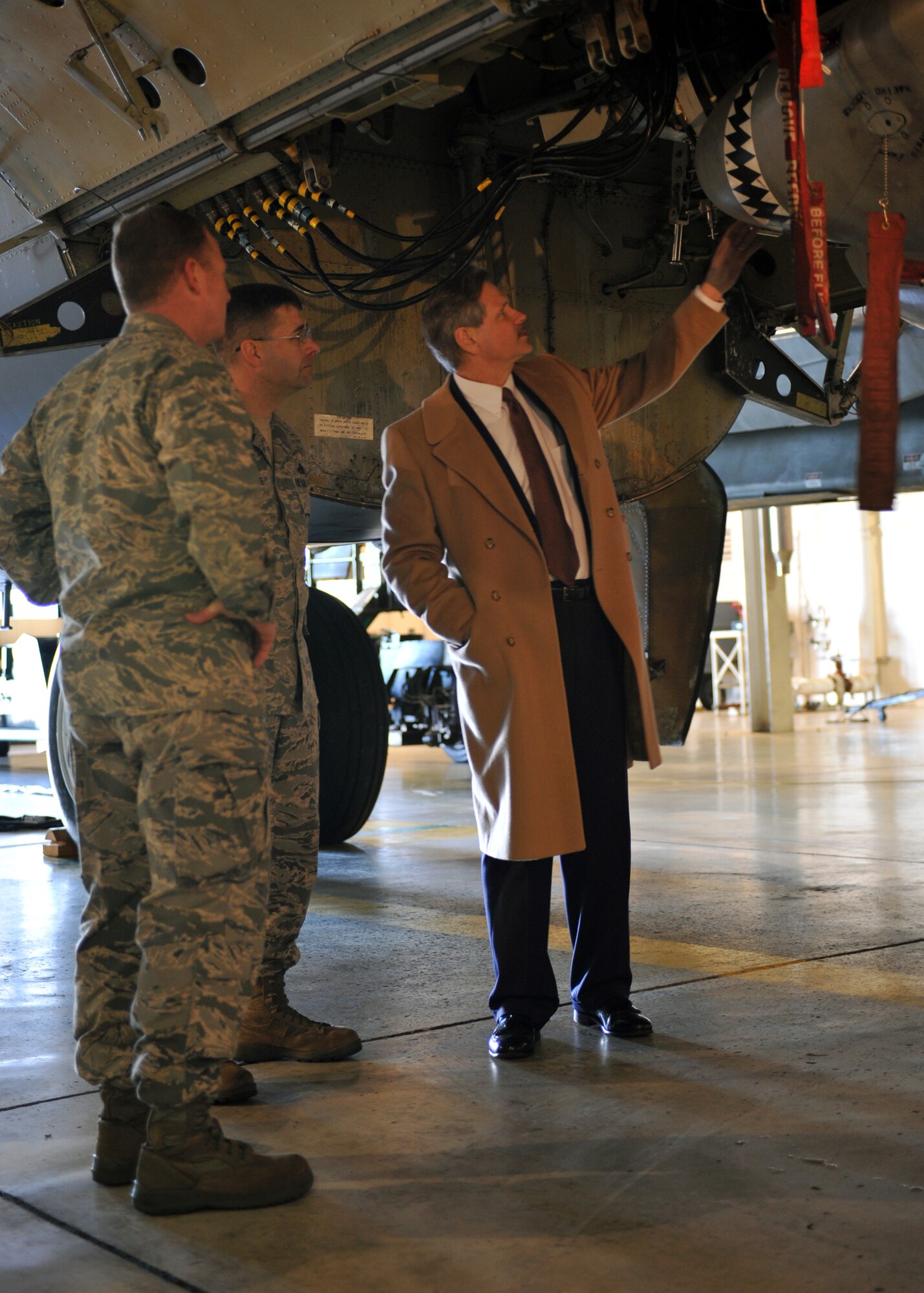 MINOT AIR FORCE BASE, N.D. -- Sen. John Hoeven, R-N.D., tours a B-52H Stratofortress with Col. Cliff Stansell, 5th Maintenance Group commander, and Senior Master Sgt. James Despiegelaere, 5th Maintenance Group wing weapons manager, here Feb. 11.  This was his first visit since being elected to the Senate to discuss topics concerning Team Minot, including military construction and the Strategic Arms Reduction Treaty. (U.S. Air Force photo/Staff Sgt. Keith Ballard)