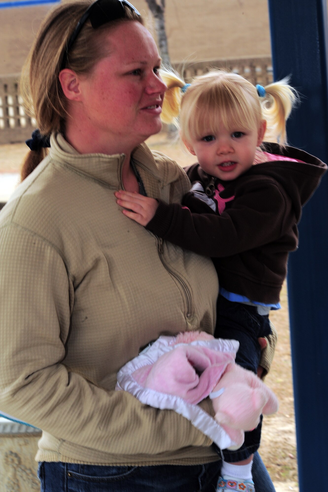 SHAW AIR FORCE BASE, S.C. -- Technical Sgt. Audrey Gippe, 20th Logistics Readiness Squadron, holds her daughter Jessica, age 2, at Kingsbury Elemntary School Feb. 16, 2011. Sergeant Gippe recently arrived back from her deployment after a mortar round went off beside her. Her husband, Tech. Sgt. Christopher Gippe, 20th Emergency Maintenance Squadron, planned the visit to the school to surprise their kids as they didn't know their mom was back. (U.S. Air Force/Airman 1st Class Daniel Phelps(Released)) 