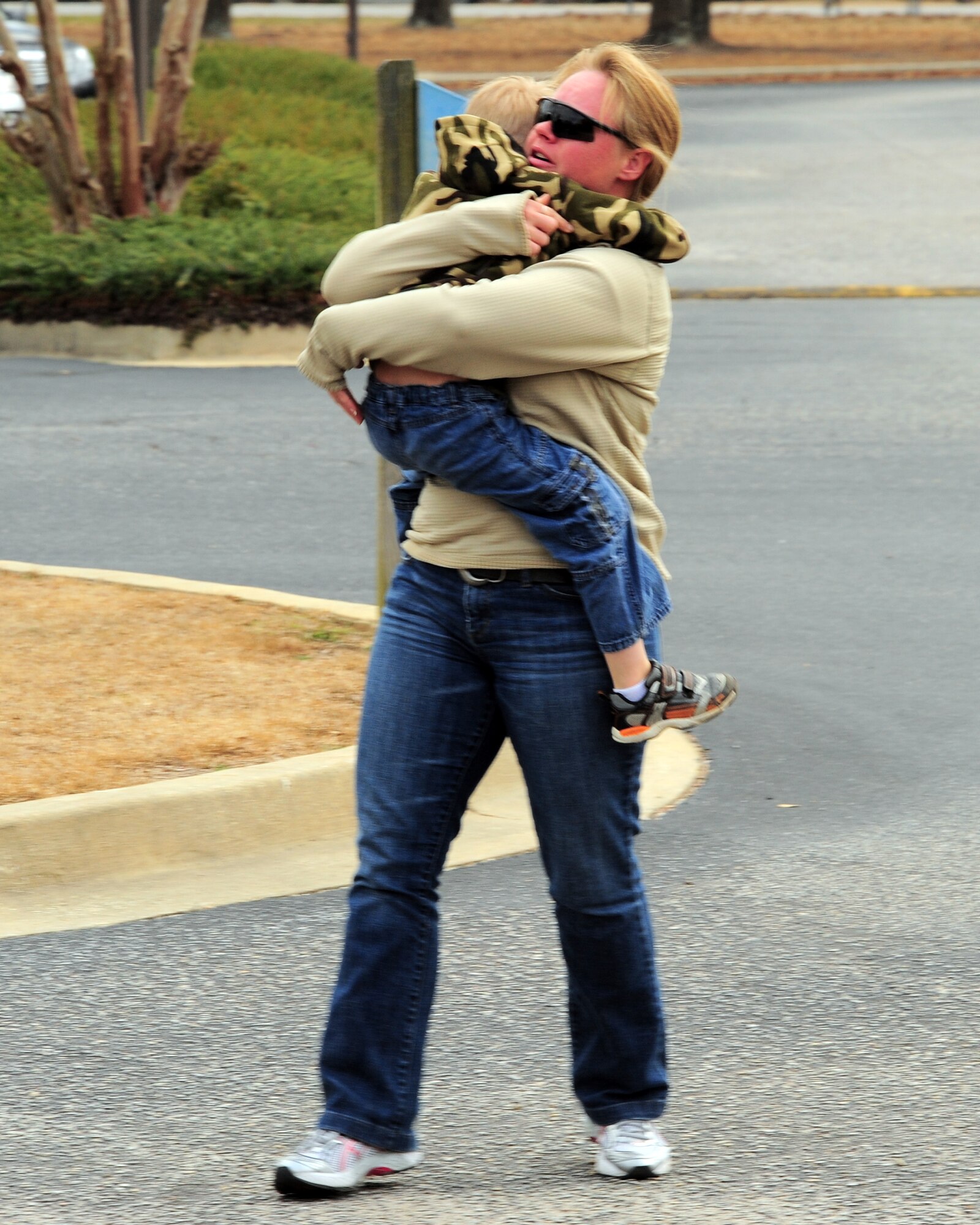 SHAW AIR FORCE BASE, S.C. -- Technical Sgt. Audrey Gippe, 20th Logistics Readiness Squadron, embraces her son Shawn, age 5, after surprising him at Kingsbury Elemntary School, Sumter, S.C. Feb. 16, 2011. Sergeant Gippe recently arrived back from her deployment after a mortar round went off beside her. Her husband, Tech. Sgt. Christopher Gippe, 20th Emergency Maintenance Squadron, planned the visit to the school to surprise their kids as they didn't know their mom was back. (U.S. Air Force/Airman 1st Class Daniel Phelps(Released)) 
