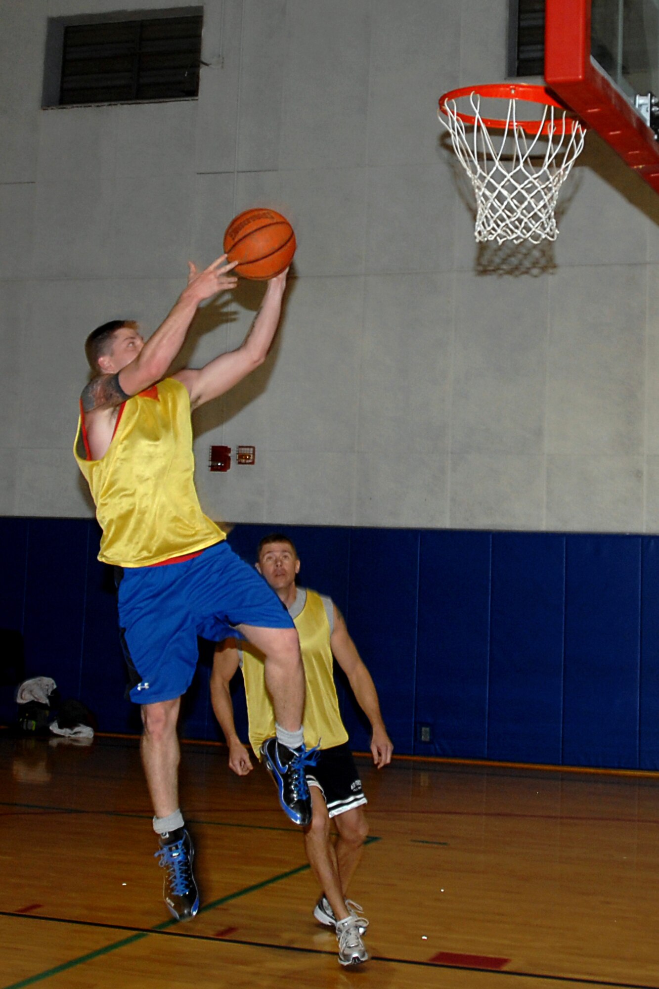 GRISSOM AIR RESERVE BASE, Ind. -- Steven Bartee, lays the ball in during quarterfinal action of Grissom's annual basketball tournament.  Bartee plays for the seasoning training flight team, and they pulled the plug on Comm,  44-15,  to advance in the double-elimination tournament. (U.S. Air Force photo/Senior Airman Carl Berry)