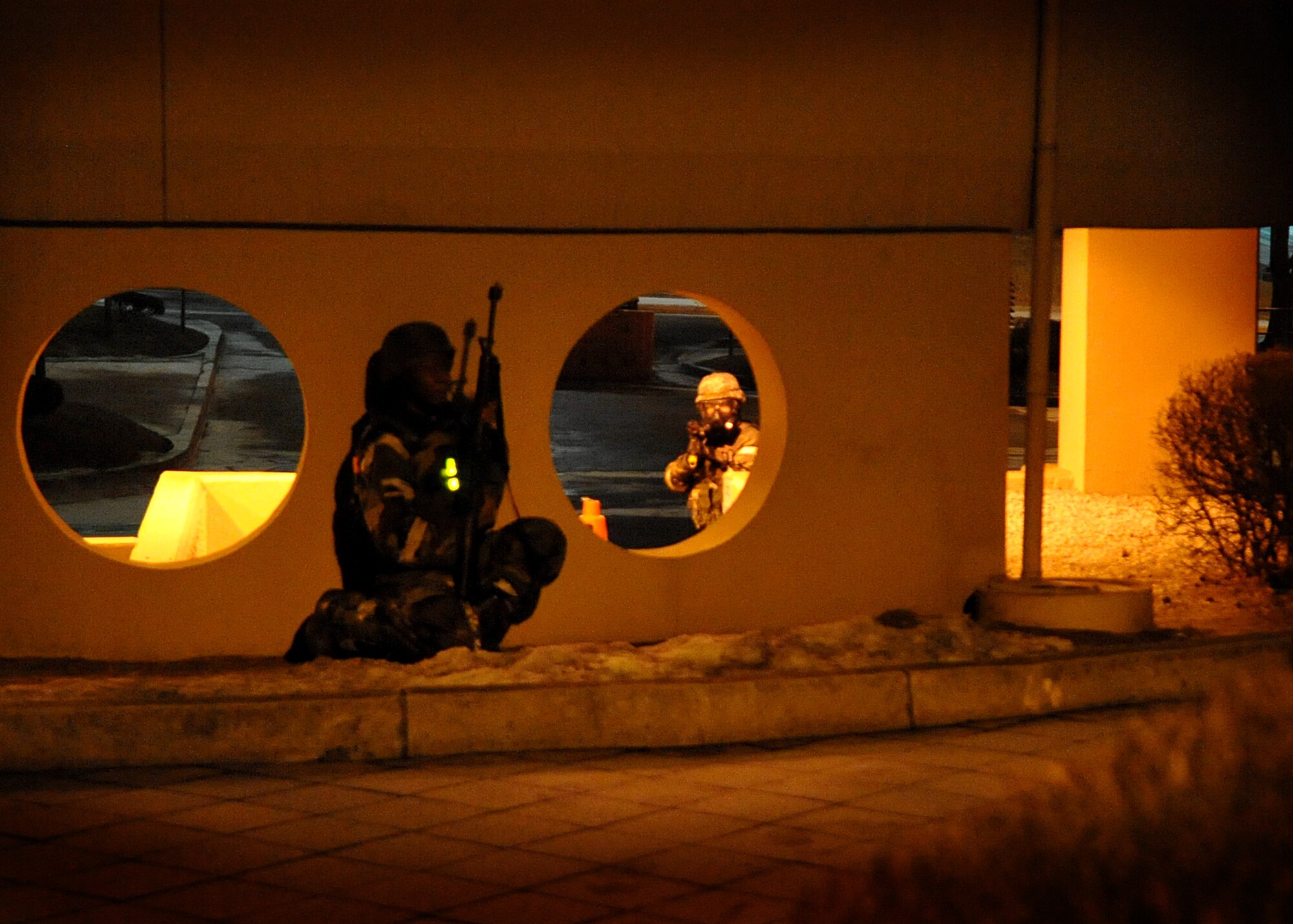 51st Fighter Wing Airmen defend the hospital after simulated attack during Operational Readiness Exercise Beverly Midnight Feb. 17 at Osan Air Base, Republic of Korea.  The scenario helped demonstrate the ability to properly defend against an opposing force attack. (U.S. Air Force Photo/Senior Airman Evelyn Chavez)