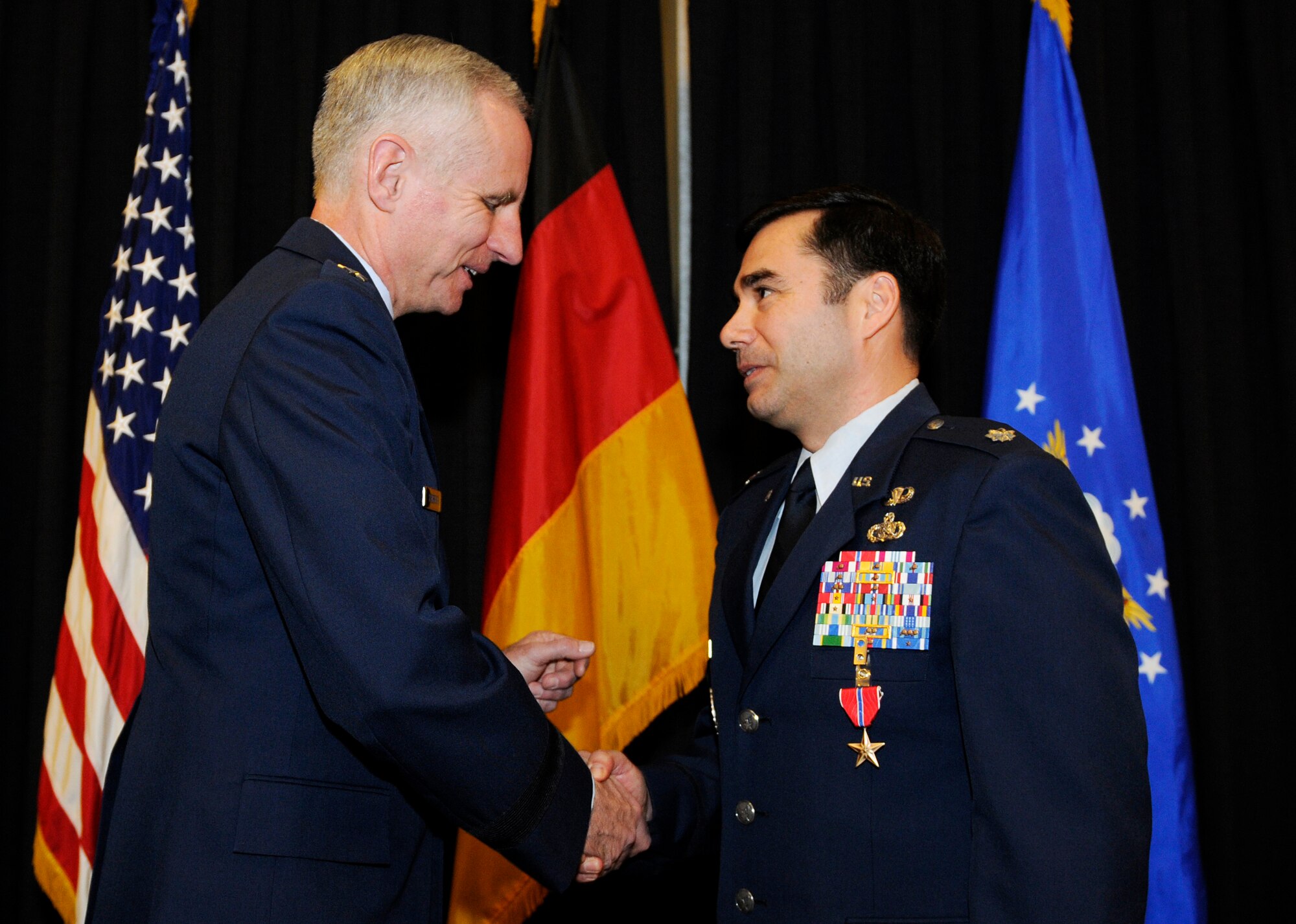 Maj. Gen. Mark Schissler, U.S. Air Forces in Europe director of the Plans, Programs and Analyses Directorate, presents the Bronze Star to Lt. Col. Antonio Castillo, USAFE Directorate of Plans, Programs and Analyses chief of the Geographically Separated Units and Activities management Branch, Feb. 14, 2011, at Ramstein Air Base, Germany. Colonel Castillo was deployed as the Regional Support Team-Capital commander, NATO Training Mission - Afghanistan and Combined Security Transition Command - Afghanistan, from Sept. 5, 2009 to March 3, 2010. He received the Bronze Star for being instrumental in supporting the Title 22 engineering and logistical requirements for more than 20,000 Afghan National Security Forces and U.S. personnel. Creating the RST-C from the ground up, Colonel Castillo led the execution of more than $39 million in engineering projects while performing in more than 100 combat missions and 30 dismount patrols throughout Kabul Province. The Bronze Star is awarded to a person in any branch of the military service who, while serving in any capacity with the U.S. Armed Forces on or after Dec. 7, 1941, shall have distinguished himself by heroic or meritorious achievement or service, not involving participation in aerial flight, in connection with military operations against an armed enemy. It can also be awarded for heroism while serving with friendly forces engaged in combat against an opposing military. (U.S. Air Force photo by Tech. Sgt. Sarayuth Pinthong)