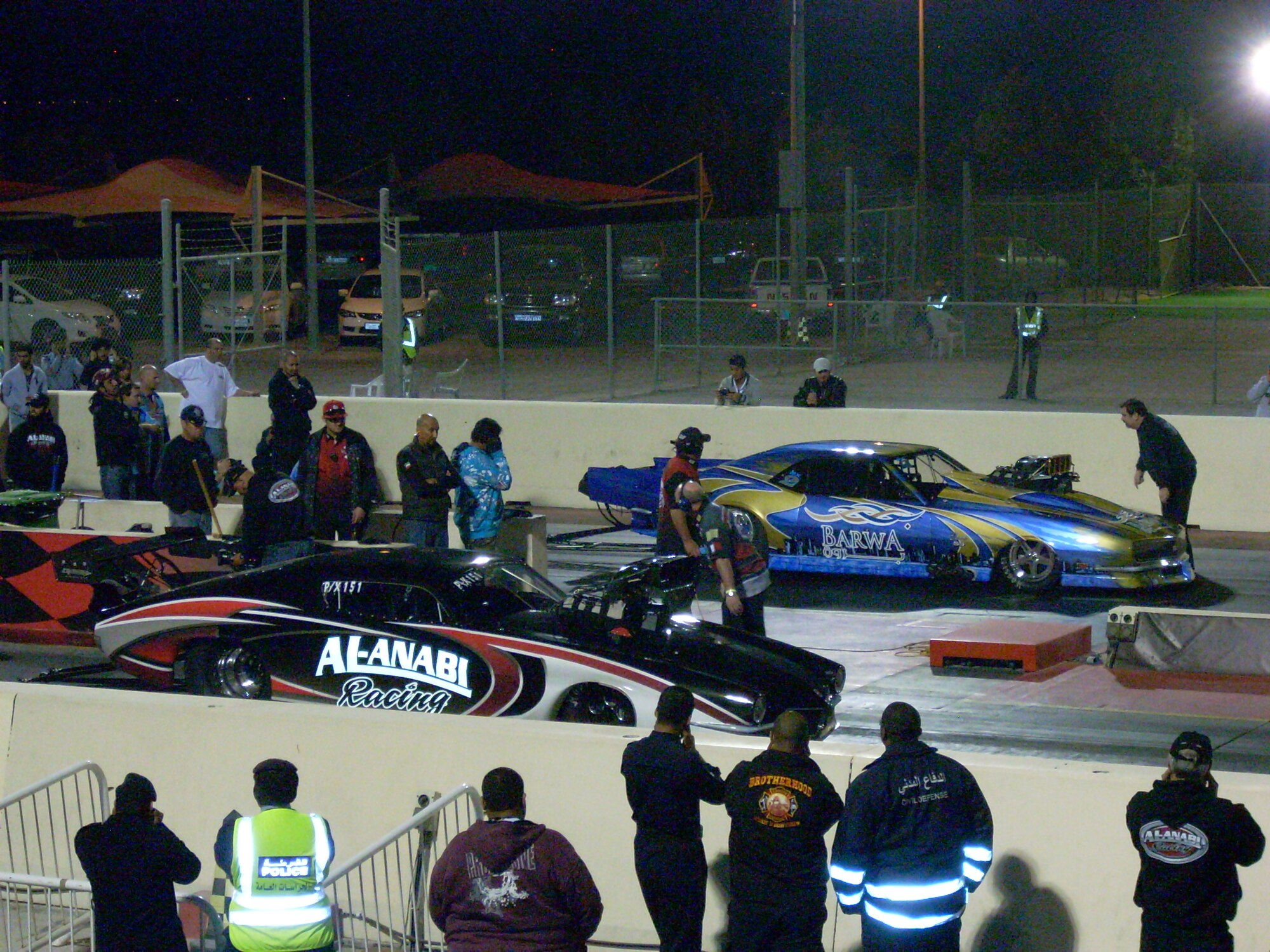 Two competing cars line up go all out on acceleration the eighth mile track in Southwest Asia. (Photo taken by Steve Wisniewski)
