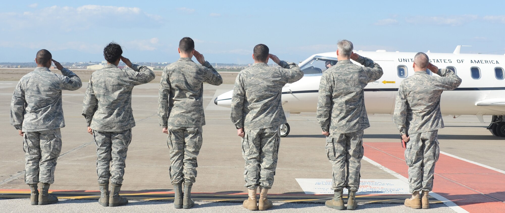 Col. Chad Butts, the 39th Air Base Wing vice commander, Lt. Col. Bryan Wolford, the 39th Operations Squadron commander, and members of Team Incirlik salute the arrival of Maj. Gen. Jack B. Egginton, the director of Air and Space Operations at Headquarters U.S. Air Forces in Europe, and Brig. Gen. John B. Cooper, the director of Logistics, Installations and Mission Support at HQ USAFE, arrive at Incirlik Air Base, Turkey, Feb. 10, 2011. Generals Egginton and Cooper visited the base to tour the facilities and talk with Airmen about upcoming changes and how they will be affected, including their role in the new Expeditionary Combat Support System. The ECSS enhances warfighter support by transforming the way the Air Force performs its logistics business. (U.S. Air Force photo by Airman 1st Class Clayton Lenhardt/RELEASED)