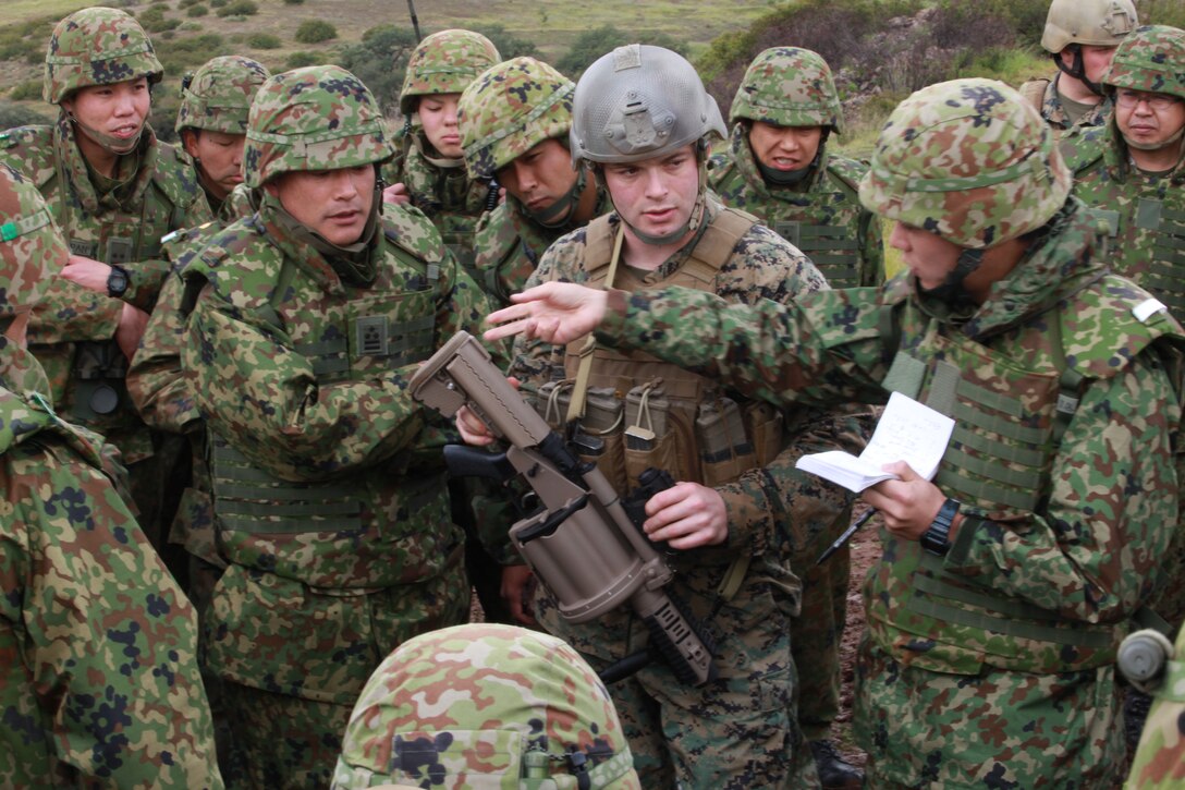U.S. Marine Corps Sgt. Ryan Visket gives a class on the M32A1 multi-shot grenade launcher to Japanese soldiers on Camp Pendleton, Calif., Feb. 16, 2011. The troops are participating in Iron Fist, a bilateral training exercise between the U.S. and Japanese militaries to increase interoperability. The Japanese soldiers are assigned to the Western Army Infantry Regiment, part of the Japan Ground Self-Defense Force.