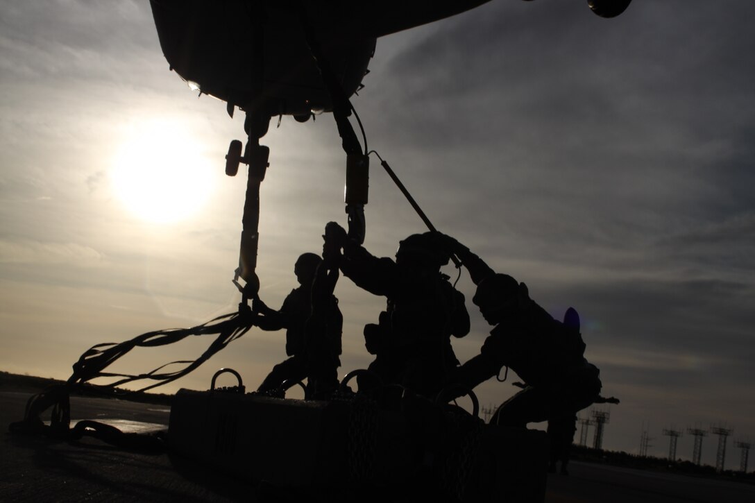 Marines from Landing Support Company, Combat Logistics Regiment 17, 1st Marine Logistics Group, get ready to attach the 8,500 pound cement block to a V-22 Osprey, Feb.17. CLR-17 is preparing for their deployment this spring.