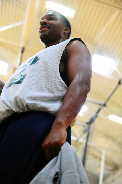 DYESS AIR FORCE BASE, Texas—Kevin Jones, 7th Aircraft Maintenance Squadron, recovers after an over-30 basketball game Feb. 17 against 39th Airlift Squadron at the fitness center here. Jones, who is one of the player-coaches, contributed 16 of 45 points scored, including eight rebounds for the game. Over-30 games are played at 11 a.m. and noon Tuesdays and Thursdays at the base fitness center. The fitness center staff schedules make-up games for those contests postponed due to winter weather earlier this month. (U.S. Air Force photo/ Airman 1st Class Courtney Moses)