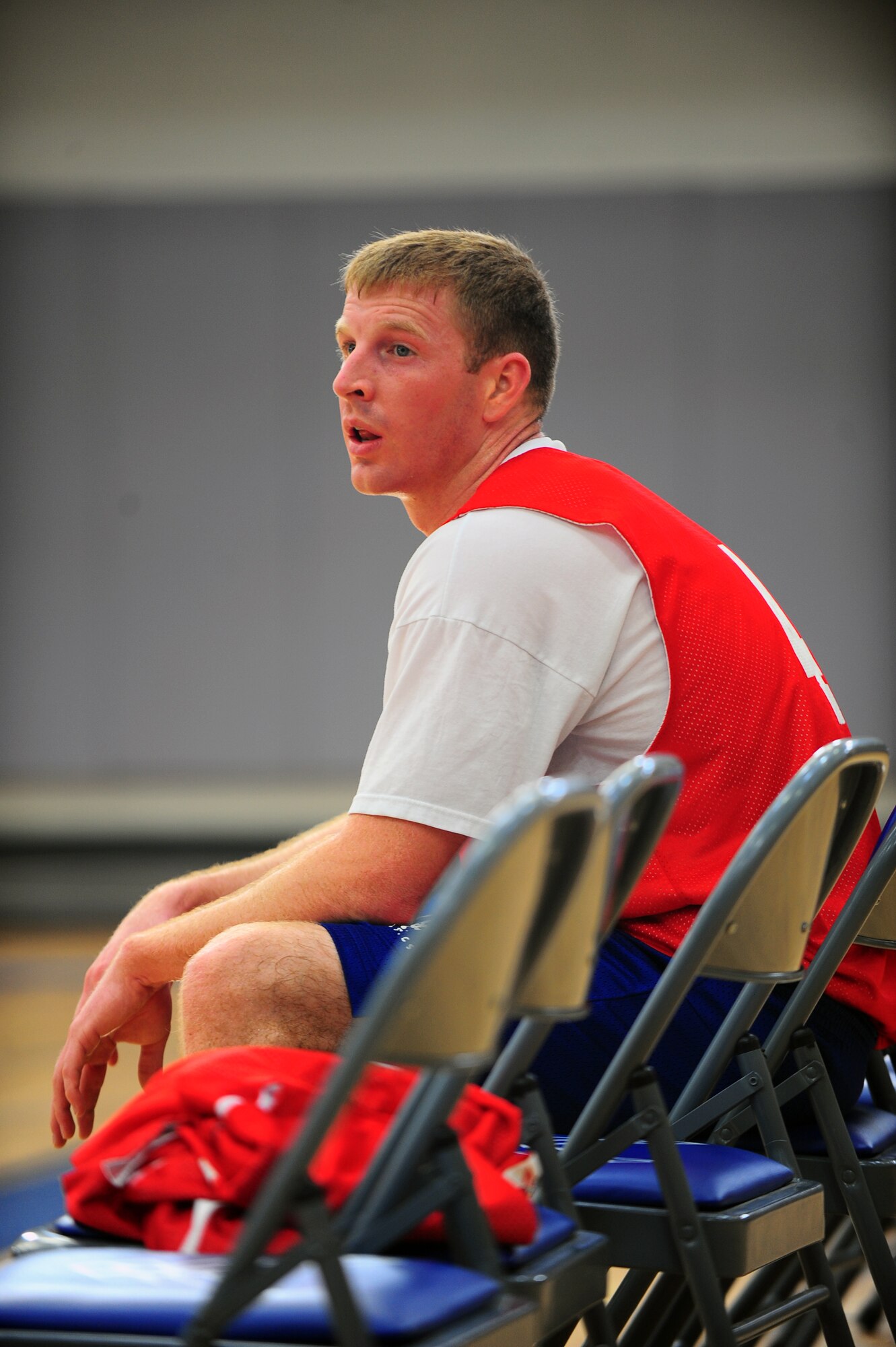 DYESS AIR FORCE BASE, Texas—Mark Hancock, 39th Airlift Squadron, sits on the bench Feb. 17 waiting to sub in during an over-30 basketball game against 7th Aircraft Maintenance Squadron at the fitness center here. Hancock contributed four of 55 points scored, including 14 rebounds and one steal. Over-30 games are played at 11 a.m. and noon Tuesdays and Thursdays at the base fitness center. The fitness center staff schedules make-up games for those contests postponed due to winter weather earlier this month. (U.S. Air Force photo/ Airman 1st Class Courtney Moses)