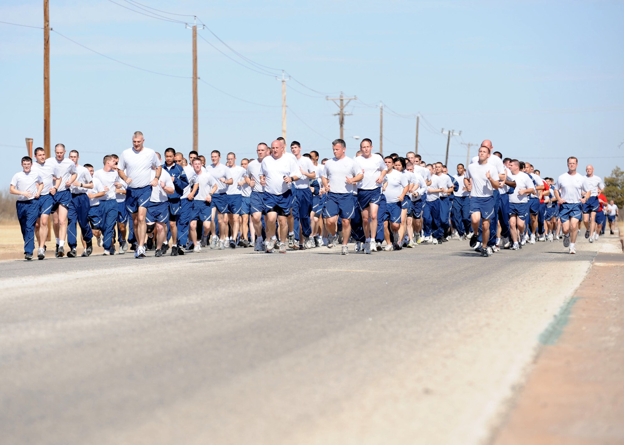DYESS AIR FORCE BASE, Texas— The 317th Airlift Group runs a mile in formation Feb. 18 as part of their wingman day here. The squadron had a no fly day so they could concentrate more on people as opposed to aircrafts. Their main objective was to work on resiliency so Airmen could learn to bounce back quickly and efficiently after going through tough times. (U.S Air Force photo/ Airman 1st Class Shannon Hall)