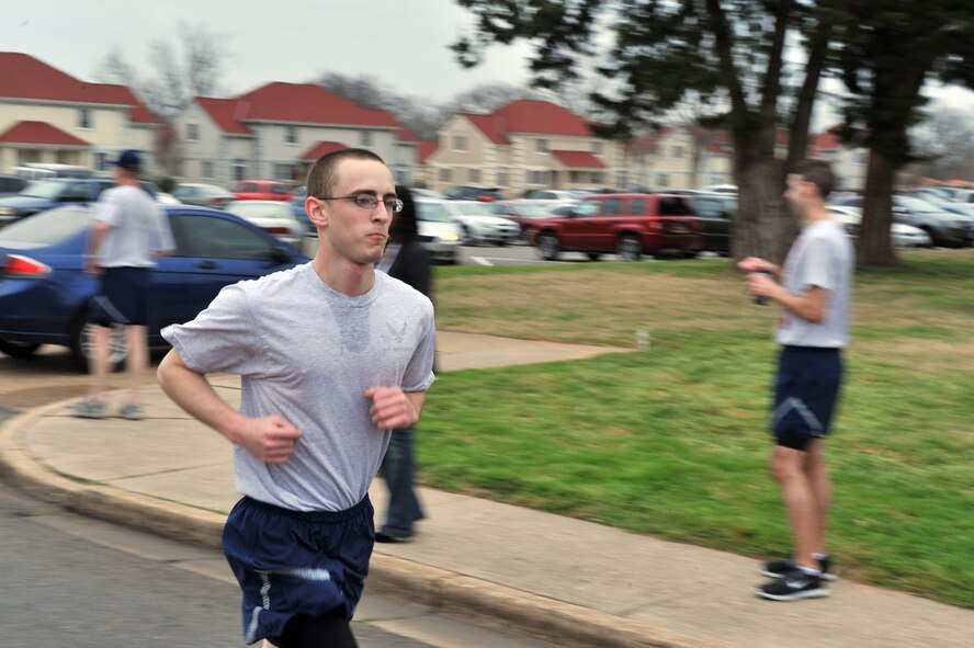 An Airman runs to the finish line during the "Bring Your Valentine" 5k run on Barksdale Air Force Base, La., Feb. 18. The 2nd Force Support Squadron held a raffle after the event which gave away workout equipment, watches and pedometers. (U.S. Air Force photo/Airman 1st Class Micaiah Anthony)(Released)