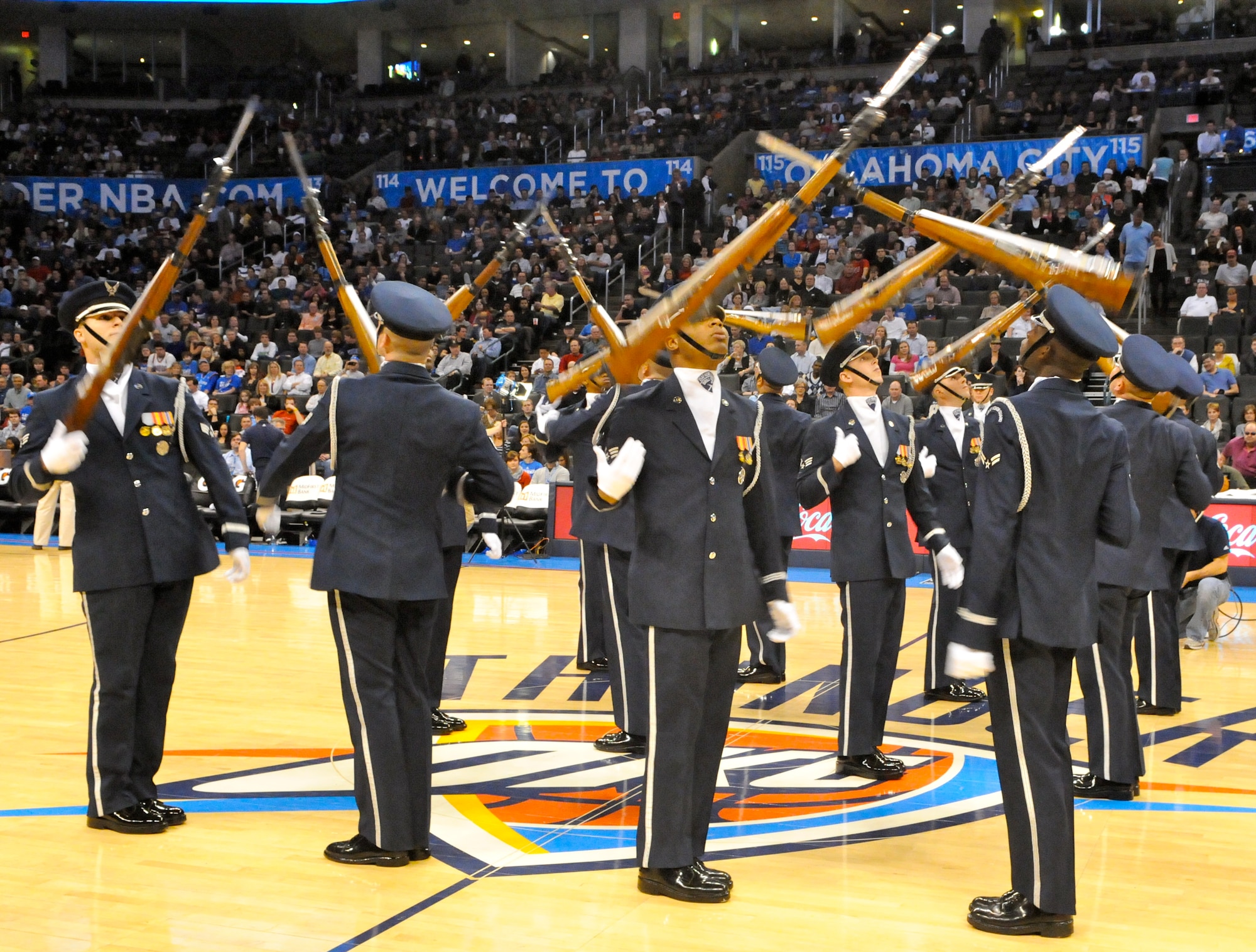 The U.S. Air Force Honor Guard drill team performs the halftime show Feb. 15 on the Oklahoma City Thunder court for military appreciation night. The drill team performs to represent the Airmen serving around the world. (U.S. Air Force photo by Airman 1st Class Tabitha N. Haynes)
