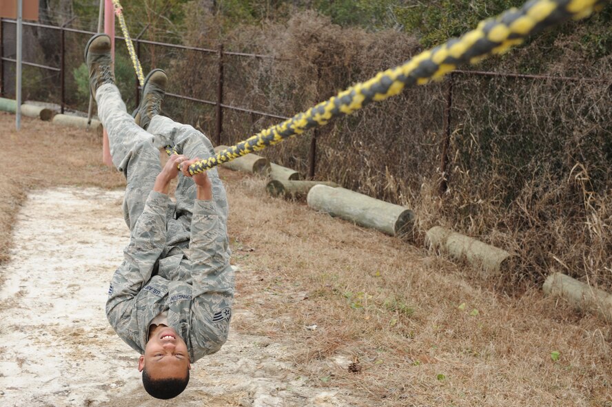 U.S. Air Force Senior Airman Travian Fearrington, 5th Force Support Squadron, Minot Air Force Base, N.D., a cross-training candidate for the Combat Controller career field proceeds through the Special Tactics Obstacle Course at Hurlburt Field, Fla., Feb. 9, 2011. Combat Controllers are committed to undertaking the most dangerous missions behind enemy lines by leading the way for other forces to follow. (U.S. Air Force photo by Airman 1st Class Caitlin O?Neil-McKeown/RELEASED)