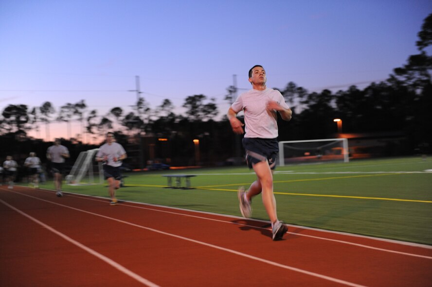 U.S. Air Force Senior Airman Douglace Fraities, ground radio communications apprentice from HickamAir Force Base, Hawaii, a cross-training candidate for the Combat Control career field runs on a track during the Special Tactics Standard Evaluation at Hurlburt Field, Fla., Feb. 8, 2011. Combat controllers are committed to undertaking the most dangerous missions behind enemy lines by leading the way for other forces to follow. (U.S. Air Force photo by Airman 1st Class Caitlin O?Neil-McKeown/RELEASED)