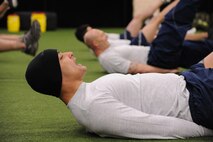 U.S. Air Force Senior Airman Eli Terry, 5th Force Support Squadron, Minot Air Force Base, N.D., a cross-training candidate for the combat controller career field does flutter kicks on Hurlburt Field, Fla., Feb. 8, 2011. Combat Controllers are committed to undertaking the most dangerous missions behind enemy lines by leading the way for other forces to follow. (U.S. Air Force photo by Airman 1st Class Caitlin O?Neil-McKeown/RELEASED) 