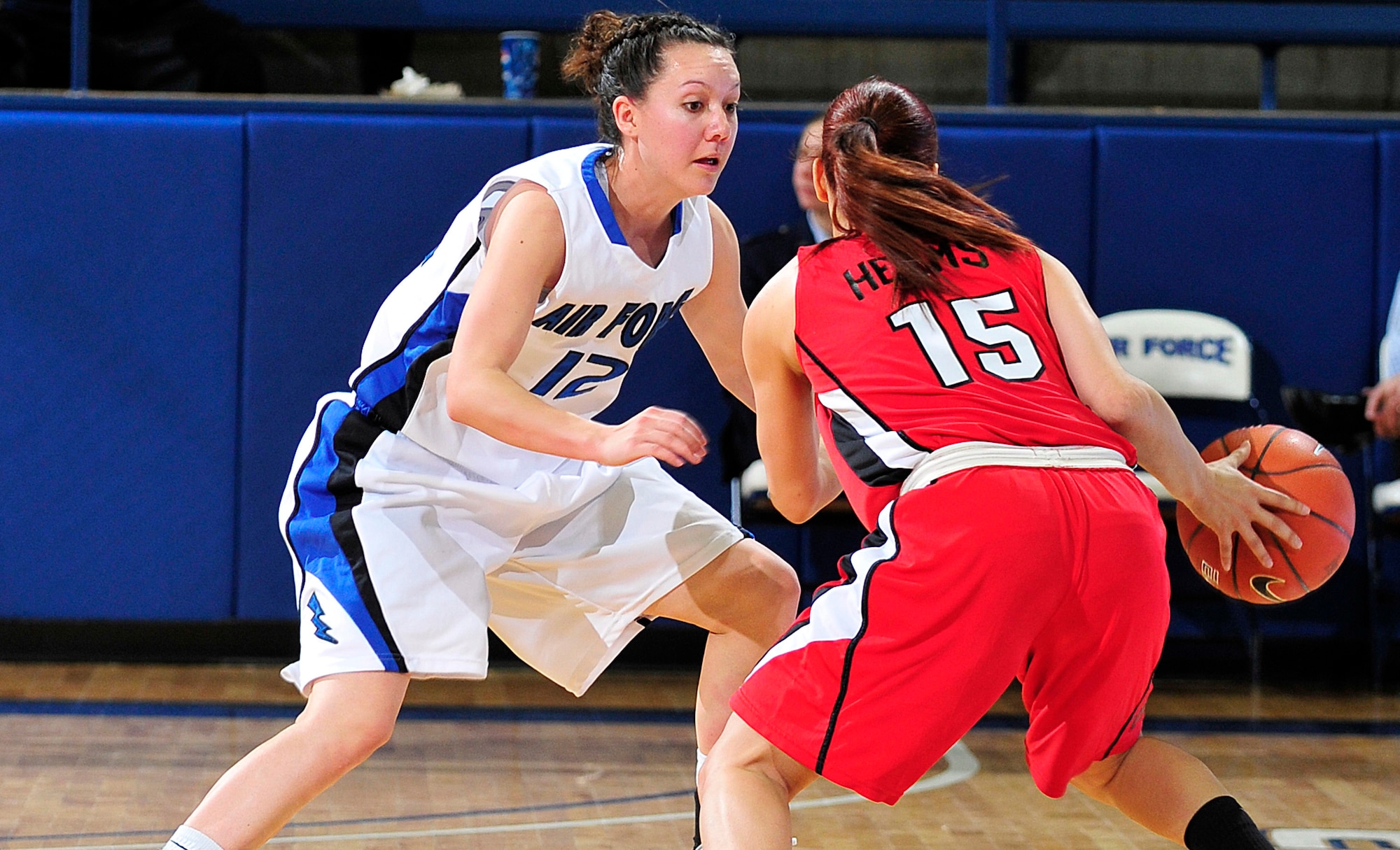Air Force's Megan Muniz defends against UNLV's Erica Helms during the Falcons' game against the Rebels at the Air Force Academy's Clune Arena Feb. 16, 2011. Muniz, a sophomore and native of Rio Rancho, N.M., had nine points and two rebounds in the Falcons' 91-87 victory. (U.S. Air Force photo/Bill Evans)