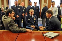 Congressman (and Air Force Reserve Maj.) John Boccieri (right, seated) talks with Col. Fritz Linsenmeyer, commander of the 910th Airlift Wing, (center, seated) and Congressman Tim Ryan (right, seated) about the 910th Airlift Wing’s aerial spray mission in the Rayburn Room of the Capitol Building, Washington, D.C., June 9, 2010. The congressmen spoke with Colonel Linsenmeyer and his small team of Youngstown Air Reserve Station Citizen Airmen about the unit’s operations in the Gulf of Mexico during the aftermath of the explosion and sinking of the Deepwater Horizon oil-drilling platform. The group also talked about the overall capabilities of the DoD’s only large-area fixed-wing aerial spray unit. 
