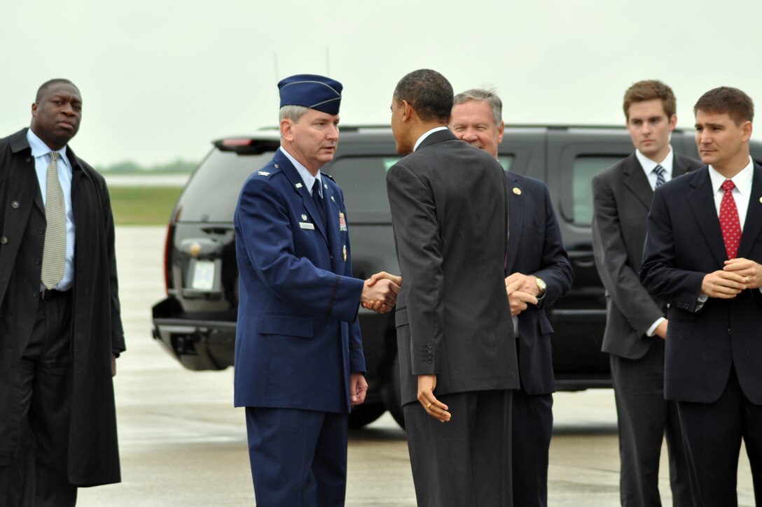 Congressman (and Air Force Reserve Maj.) John Boccieri (far right) watches as President Barack Obama shakes hands with Col. Fritz Linsenmeyer, commander of the 910th Airlift Wing, on the Youngstown Air Reserve Station flightline, May 18, 2010. After a two-year term in the U.S. House of Representatives, the former legislator has returned to the 910th Airlift Wing’s 773rd Airlift Squadron to resume his duties as a C-130 pilot and aircraft commander.