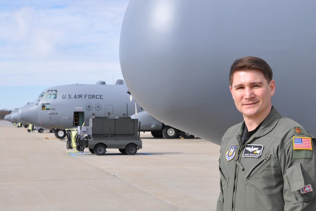 YOUNGSTOWN AIR RESERVE STATION, Ohio -- Air Force Reserve Maj. John Boccieri stands near a C-130H Hercules tactical cargo transport aircraft on the flightline here, Feb. 18. Major Boccieri recently returned to duty as pilot and aircraft commander with the 910th Airlift Wing's 773rd Airlift Squadron after a two-year term as U.S. Congressman for Ohio's 16th district. U.S. Air Force photo by Master Sgt. Bob Barko Jr. 