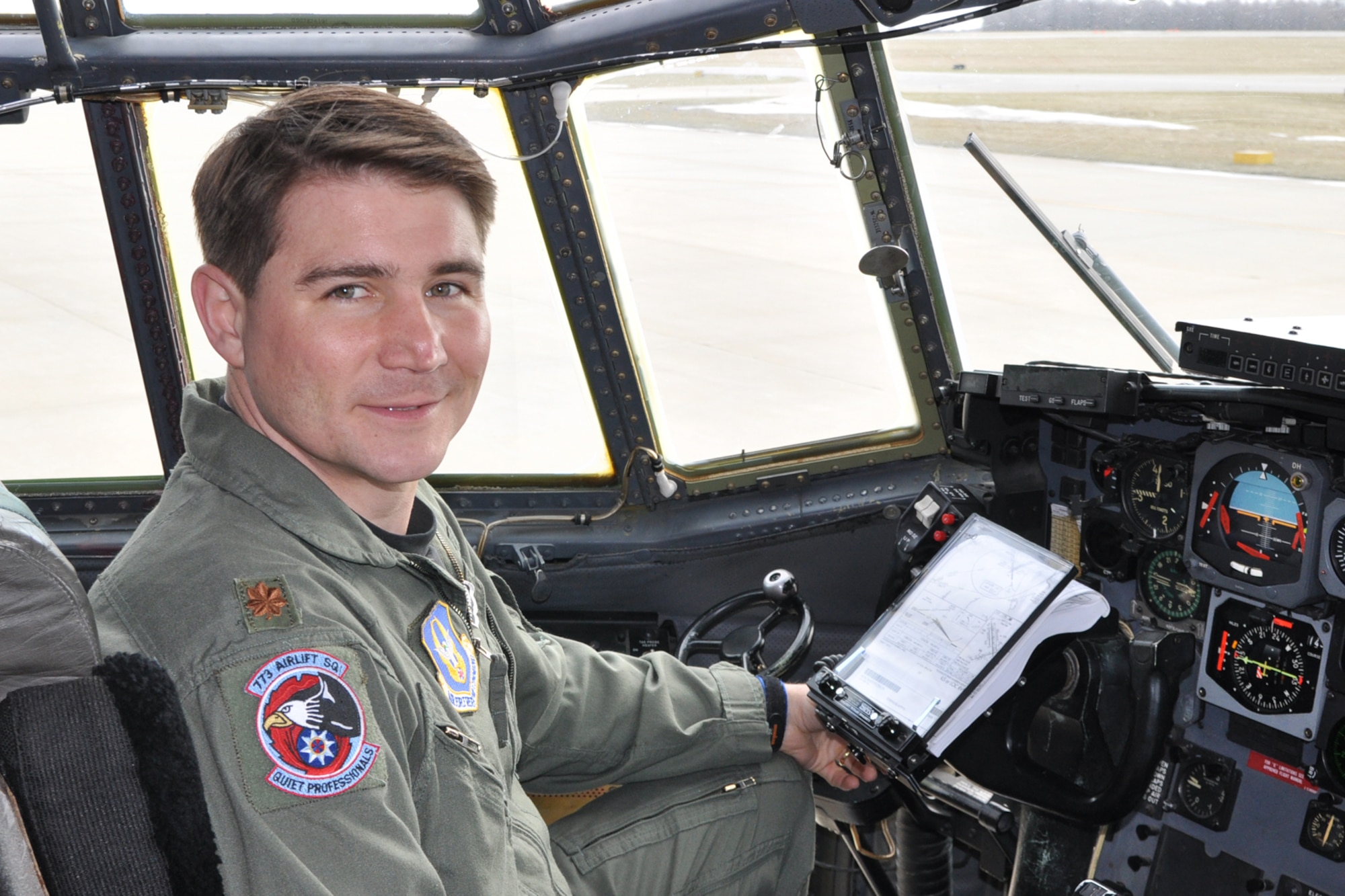 YOUNGSTOWN AIR RESERVE STATION, Ohio -- Air Force Reserve Maj. John Boccieri sits in the pilot's seat on the flight deck of a C-130H Hercules  tactical cargo transport aircraft on the flightline here, Feb. 18. Major Boccieri recently returned to duty as pilot and aircraft commander with the 910th Airlift Wing's 773rd Airlift Squadron after a two-year term as U.S. Congressman for Ohio's 16th district. U.S. Air Force photo by Master Sgt. Bob Barko Jr. 
