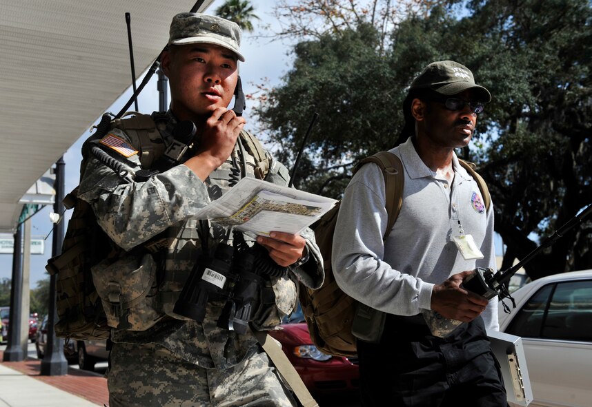 AVON PARK, Fla.-- Army Pfc. Jayson Back, 2nd Battalion 5th Infantry Regiment joint fires observer, walks with Edward Taylor, analyst for joint fires integration and inoperability team during joint exercise ATLANTIC STRIKE 11-01 Feb. 16. The JFOs were being analyzed for how well they performed at their duties during the scenario. (U.S. Air Force photo/Airman 1st Class Nicholas Benroth)(RELEASED)