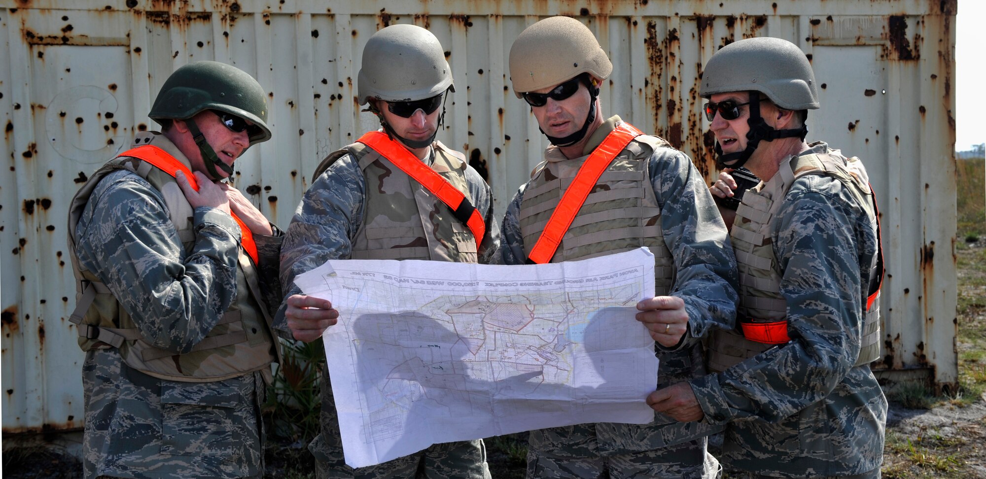 AVON PARK, Fla.-- Distinguished visitors which include Maj. Gen. Stephen Hoog, 9th Air Force commander, and Col. Gary Henderson, 23rd Wing commander from Moody Air Force Base, Ga., studies a map of the joint exercise ATLANTIC STRIKE 11-01 Feb. 16. The visitors toured different sections of the exercise to watch the joint teams in action. (U.S. Air Force photo/Airman 1st Class Nicholas Benroth)(RELEASED)