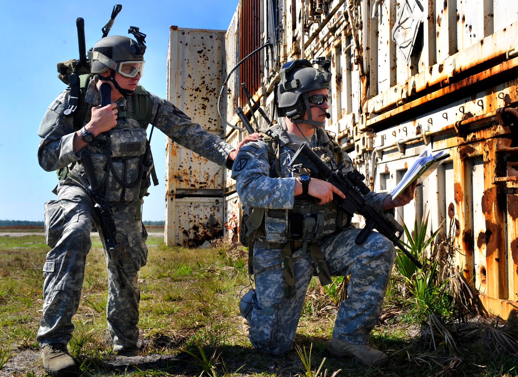 AVON PARK, Fla.-- Staff Sgt. Nicholas Palazzolo and Airman 1st Class Brian Nawrocki, 18th Air Support Operations Group, Ft. Hood. Texas joint terminal attack controllers, prepare to call in close air support on a village during joint exercise ATLANTIC STRIKE 11-01 Feb. 15. The job of the JTACs was to coordinate with the ground commander on whether close air support was needed during their assault on the village. (U.S. Air Force photo/Airman 1st Class Nicholas Benroth)(RELEASED)