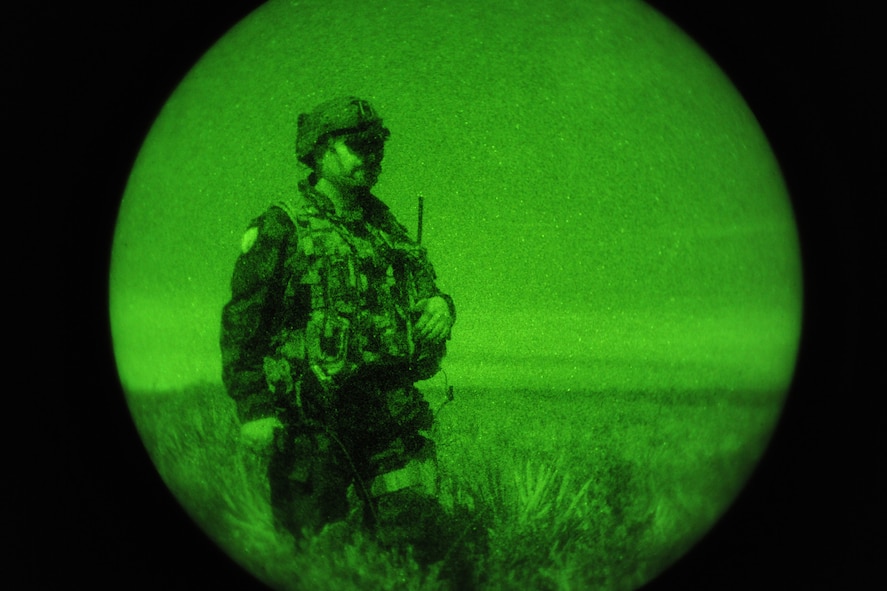 AVON PARK, Fla.-- Slovenian army Višji Štabni Vodnik (Sgt 1st Class) Sergei Savov, 1st Brigade joint terminal attack controller, scans the horizon for enemy forces during joint exercise ATLANTIC STRIKE 11-01 Feb. 15. Sergeant Savov participated with three other Slovenian army members to conduct operations with U.S. forces during the joint exercise. (U.S. Air Force photo/Airman 1st Class Benjamin Wiseman)(RELEASED)