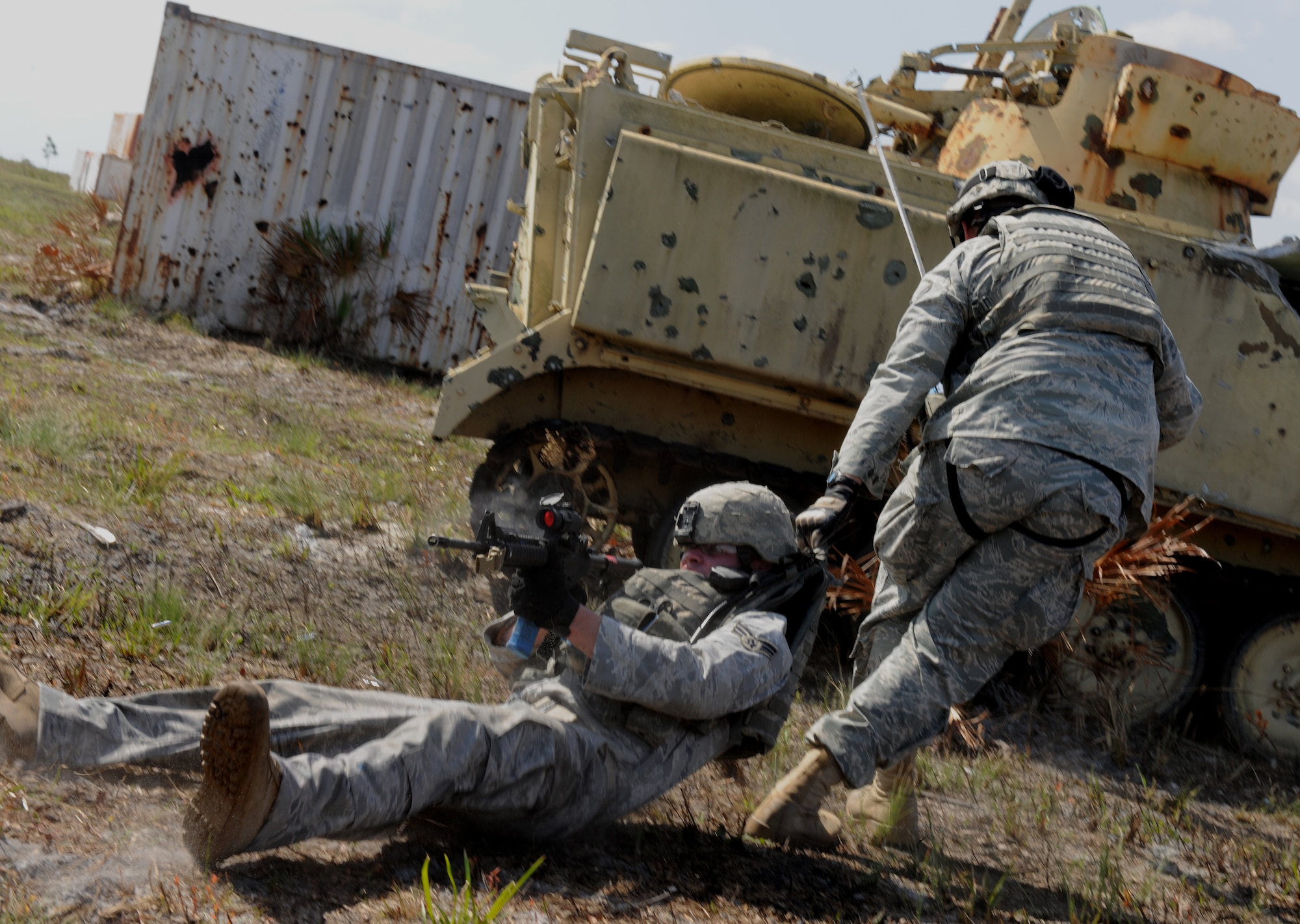 AVON PARK, Fla.-- Senior Airman Menva Abelian, 823rd Base Defense Squadron fire team member, Moody Air Force Base, Ga., drags a member of his fire team to safety during joint exercise ATLANTIC STRIKE 11-01 Feb. 16. Members from the 823rd BDS acted as forward ground forces during the joint exercise. (U.S. Air Force photo/Airman 1st Class Benjamin Wiseman)(RELEASED)