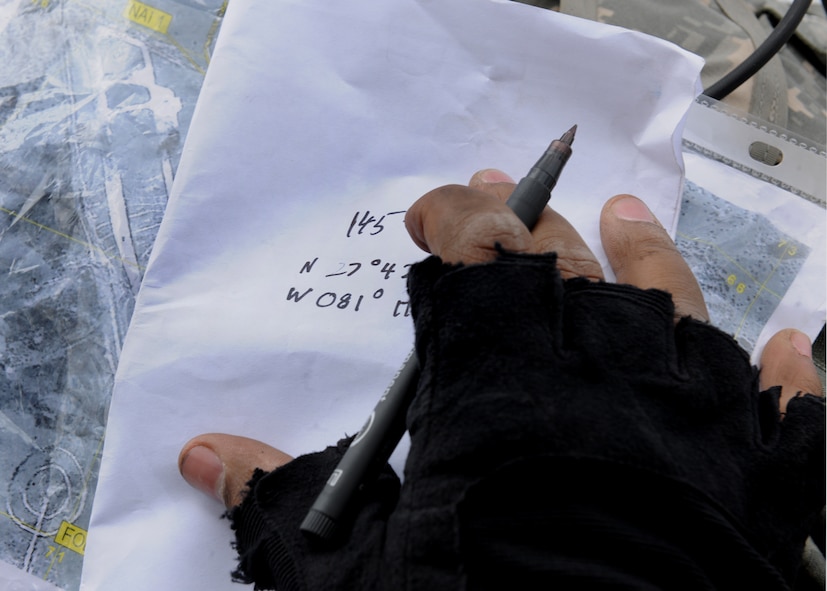 AVON PARK, Fla.-- A joint terminal attack controller writes coordinates from a map during joint exercise ATLANTIC STRIKE 11-01 Feb. 16. During the exercise, there were four sections t the JTAC units cycled through to work each concept of a real-world mission. (U.S. Air Force photo/Airman 1st Class Benjamin Wiseman)(RELEASED)