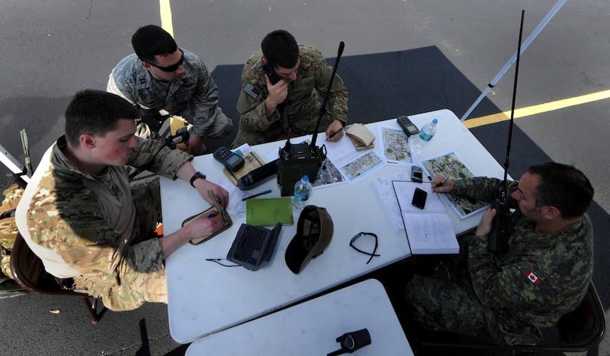 AVON PARK, Fla.-- Canadian army Lieutenant (1st Lt.) Darcy Cyr, Airline Integration Cell national joint terminal attack controller standards officer, works with JTACs from the 19th Air Support Operations Squadron from Fort Campbell, Ky., during joint exercise ATLANTIC STRIKE 11-01 Feb. 16. This joint exercise brought JTAC personnel from around the country to work with joint forces from other nations. (U.S. Air Force photo/Airman 1st Class Benjamin Wiseman)(RELEASED)