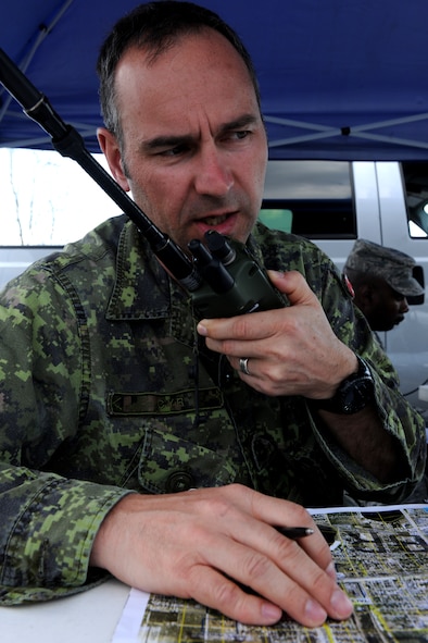 AVON PARK, Fla.-- Canadian army Lieutenant (1st Lt.) Darcy Cyr, Airline Integration Cell national joint terminal attack controller standards officer, communicates with  downrange troops during joint exercise ATLANTIC STRIKE 11-01 Feb. 16. Lieutenant Cyr acted as a training leader for JTAC personnel during the exercise. (U.S. Air Force photo/Airman 1st Class Benjamin Wiseman)(RELEASED)