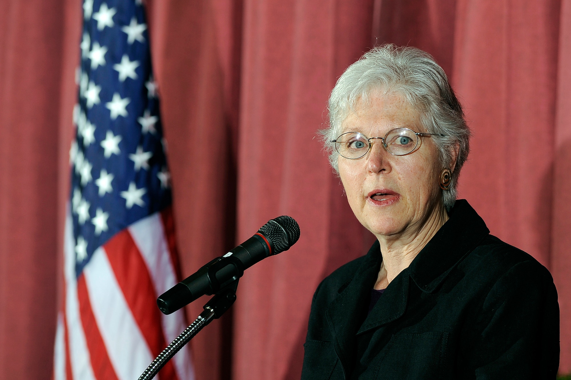 Sarah Bender offers a Buddhist prayer during the Air Force Academy's National Prayer Luncheon in the Falcon Club Feb. 10, 2011. Members of the Islamic, Jewish and Christian religions also offered prayer readings. Ms. Bender is the sensei for the Academy's "Vast Refuge" sangha. (U.S. Air Force photo/Mike Kaplan)