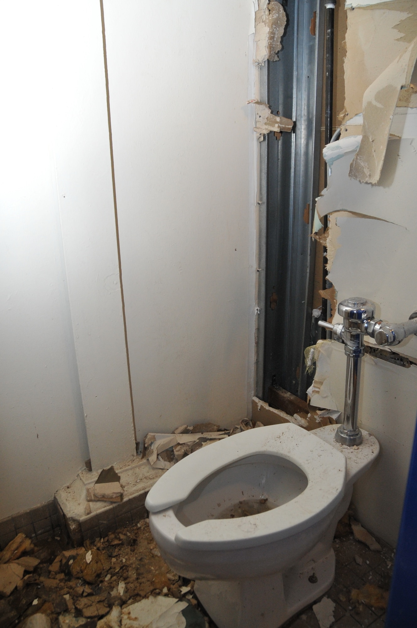 Freeze-ruptured water pipes damaged walls and floors in many buildings.  U.S. Air Force Photo by Elizabeth Martinez.