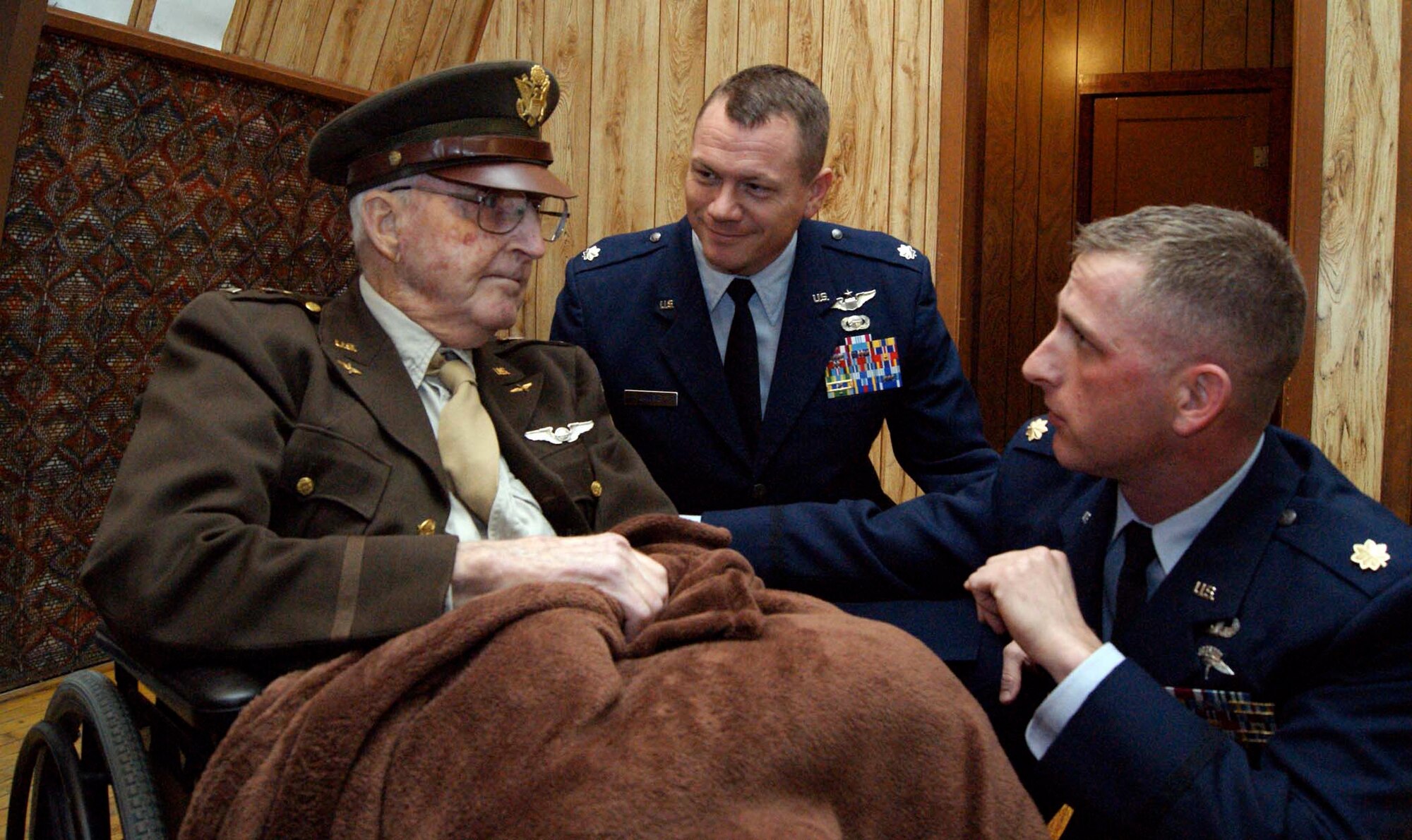 Gordon Ballagh (left to right), a World War II veteran, Lt. Col. Stan Lawrie and Maj. Darrin DeReus pose for photograph just before a ceremony Feb. 9, 2011, in Burwell, Neb. The ceremony was in honor of Mr. Ballagh, who received a Prisoner of War Medal, the World War II Victory Medal, the American Campaign Medal and the Euro-African-Middle Eastern Medal, after more than 65 years. Colonel Lawrie is the 22nd Air Refueling Wing Safety chief. Major DeReus is the 22nd Comptroller Squadron commander. (Courtesy photo) 