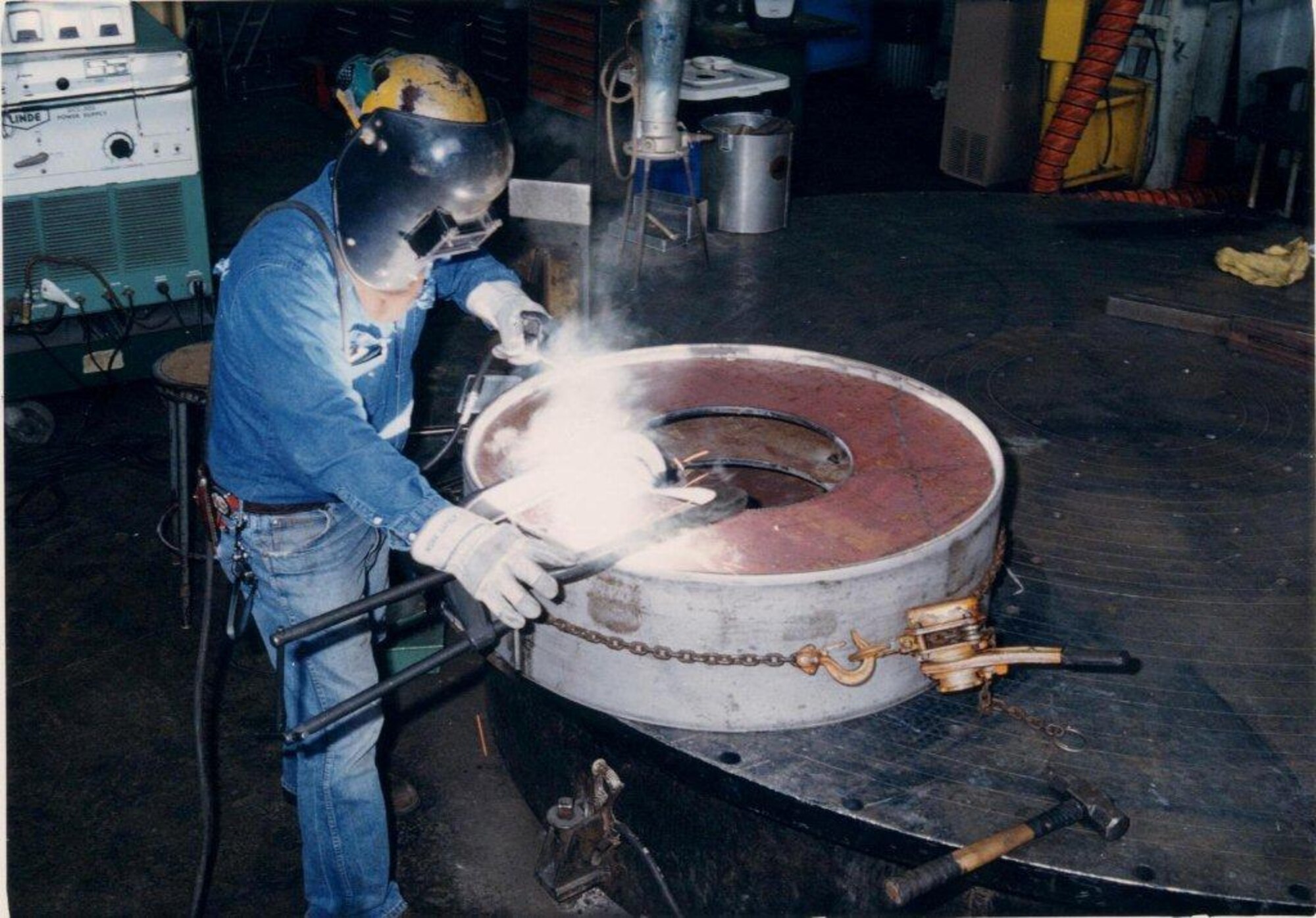 ATA Boilermaker Ray Powers welds from a stainless steel spool in the Model Shop on a project for one of AEDC’s test facilities. The boilermakers fabricate, install and maintain large sections of metal ducting, the components making up wind tunnels, pressure vessels, seals, coolers, storage tanks, heat exchangers, boilers, test cells, diffusers, venturis, bell mouths and nozzles. They also work on support structures like ladders and rigging. (Photo provided)