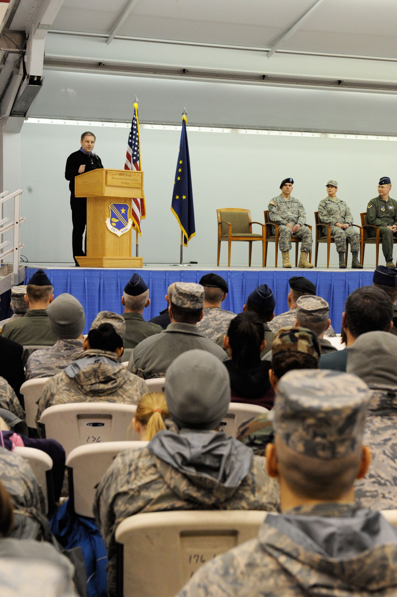 Gov. Sean Parnell addresses service members and well wishers during the ceremony which marked the arrival of the 176th Wing into Joint Base Elmendorf-Richardson hangars, Saturday. (U.S. Air Force photo/Staff Sgt. Joshua Garcia)