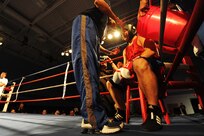 Senior Amn. Kent Brinson Jr. listens to advice from Air Force boxing coach Steve Franco during his Armed Forces Boxing Championship heavyweight fight Feb. 15 at Lackland Air Force Base, Texas. Originally from Monroe, Mich., Airman Brinson is a three-time Toledo Golden Gloves champion, having won the title in 2004, 2005 and 2006. The AFBC is an elite competition between the U.S. military service branches. Winning a gold medal in the event qualifies the athlete to compete in the 2012 Olympic team trials. (U.S. Air Force photo/Staff Sgt. Sharida Jackson)