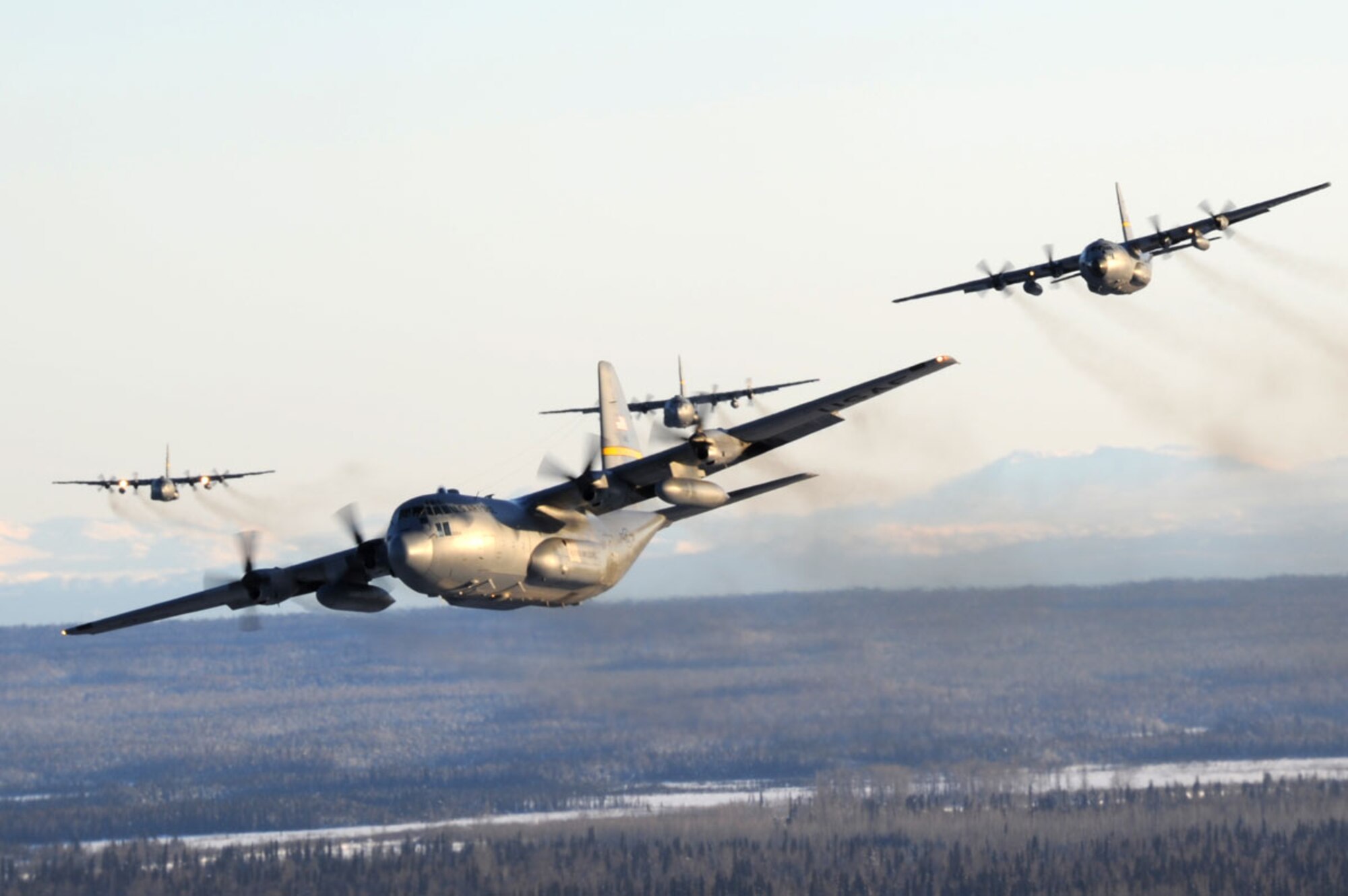 Alaska Air National Guard, 176th Wing HC-130 and C-130 Hercules aircraft fly on their way to Joint Base Elmendorf-Richardson from Kulis Air National Guard Base, Saturday, during the Kulis closure and “fly away” ceremony. (Air Force photo/Staff Sgt. Joshua Garcia)