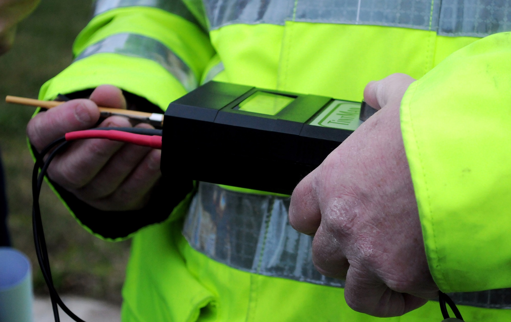 RAF MILDENHALL, England -- Police Constable Paul Glover, Ministry of Defence Police RAF Mildenhall, calibrates a photoptic vehicle tint tester here Feb. 18, 2011.  PC Glover tested windows at the main entrance gate to ensure Airmen's vehicles were conforming to United Kingdom laws. Suffolk Police are carrying out a 30-day amnesty all over Suffolk and are offering free visible light transmission tests. However, if stopped after March 9, 2011, vehicle-owners will be prosecuted. (U.S Air Force photo/Senior Airman Tabitha M. Lee)