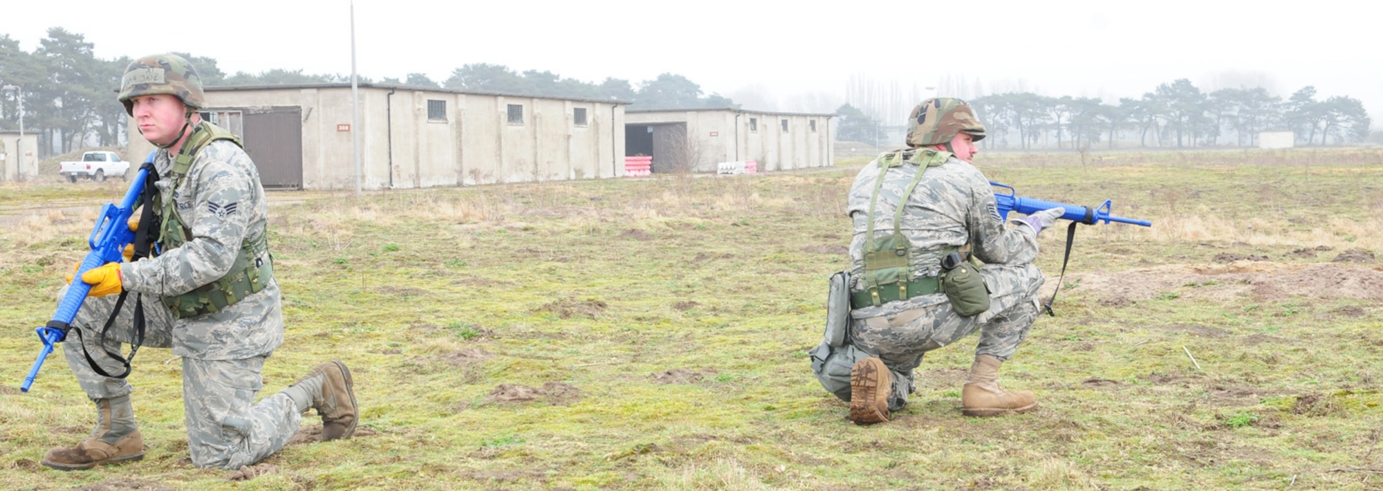 RAF MILDENHALL, England -- Senior Airman James Hanna and Tech. Sgt. Adam Parks, both 100th Civil Engineer Squadron, train on creating a safe perimeter for work party security at the "300 area" in Beck Row Feb. 17, 2011. The area is being handed back to the Ministry of Defence and 100th CES members performed a mass clean up, saving the base about $9,000 in contracting fees. They also used the opportunity to fulfil training requirements like convoy operations for Prime BEEF, or base engineer emergency force. (U.S. Air Force photo/Karen Abeyasekere)