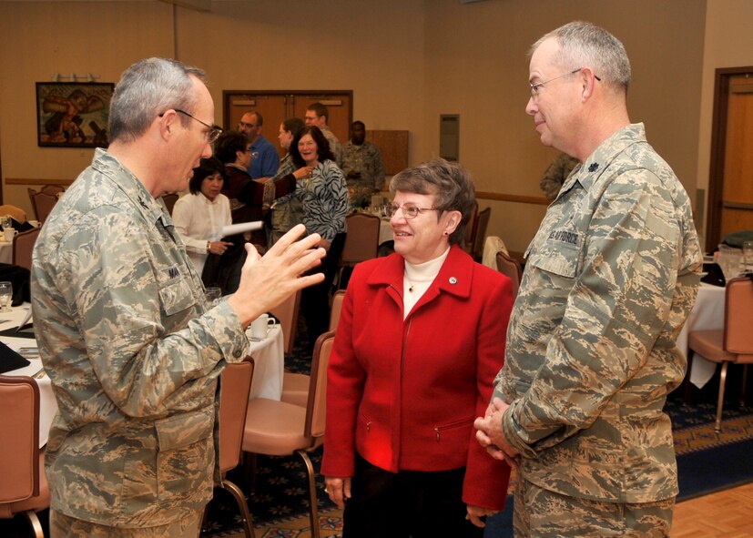 Colonel Robert L. Maness, 377th Air Base Wing commander, left, speaks with retired Chaplain (Maj. Gen.) Lorraine Potter and Chaplain (Lt. Col.) David Mansberger Feb. 11 before the National Prayer Breakfast. U.S. Air Force Photo by Todd Berenger. 