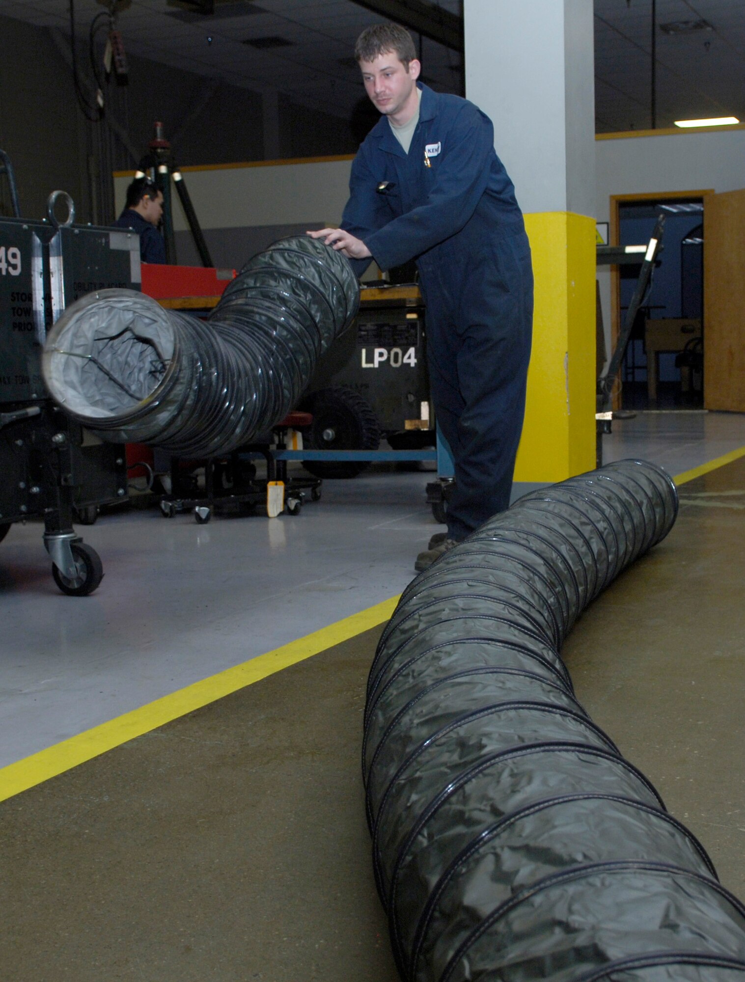 Senior Airman James Kenedy, 92nd Maintenance Squadron aerospace ground equipment technician, inspects heater ducts for tears and rips Feb. 15, 2011 at Fairchild. These heaters came to Fairchild from another base so; Airman Kenedy is inspecting them to ensure they’re ready for use. If no discrepancies are found on the heaters, they will be used to heat internal aircraft components at Spokane International Airport. (U.S. Air Force Photo/Senior Airman Natasha E. Stannard)