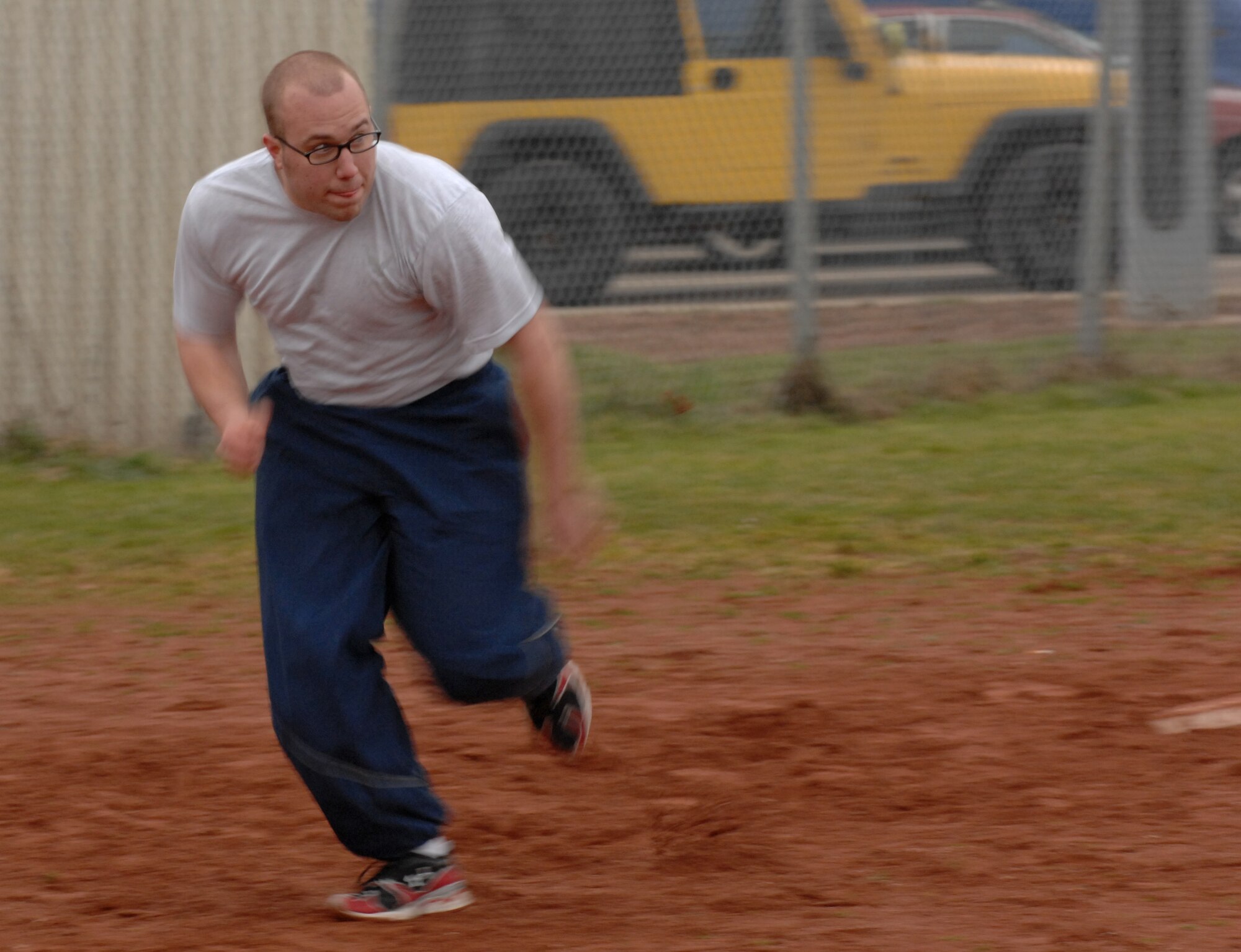 SPANGDAHLEM AIR BASE, Germany – Airman 1st Class Riley Wendt, 52nd Aircraft Maintenance Squadron avionics apprentice, runs toward home base during a softball game during the 2011 Wingman Day Feb. 18. Wingman Day is used to reinforce the wingman concept and focus on the health and support of 52nd Fighter Wing units. (U.S. Air Force photo/Airman 1st Class Matthew Fredericks)