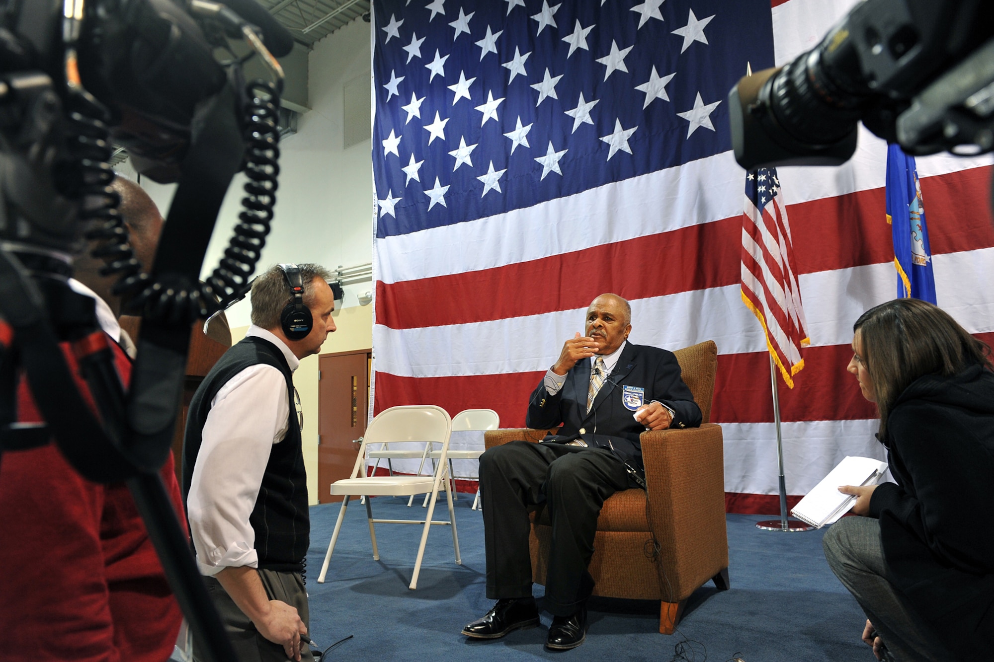 OFFUTT AIR FORCE BASE, Neb. - Local media broadcasters interview former Corporal Roberts Holtz, an original Tuskegee Airmen, after the Tuskegee Airmen event inside the James M. McCoy Airmen Leadership School Auditorium. U.S. Air Force Photo by Charles Haymond