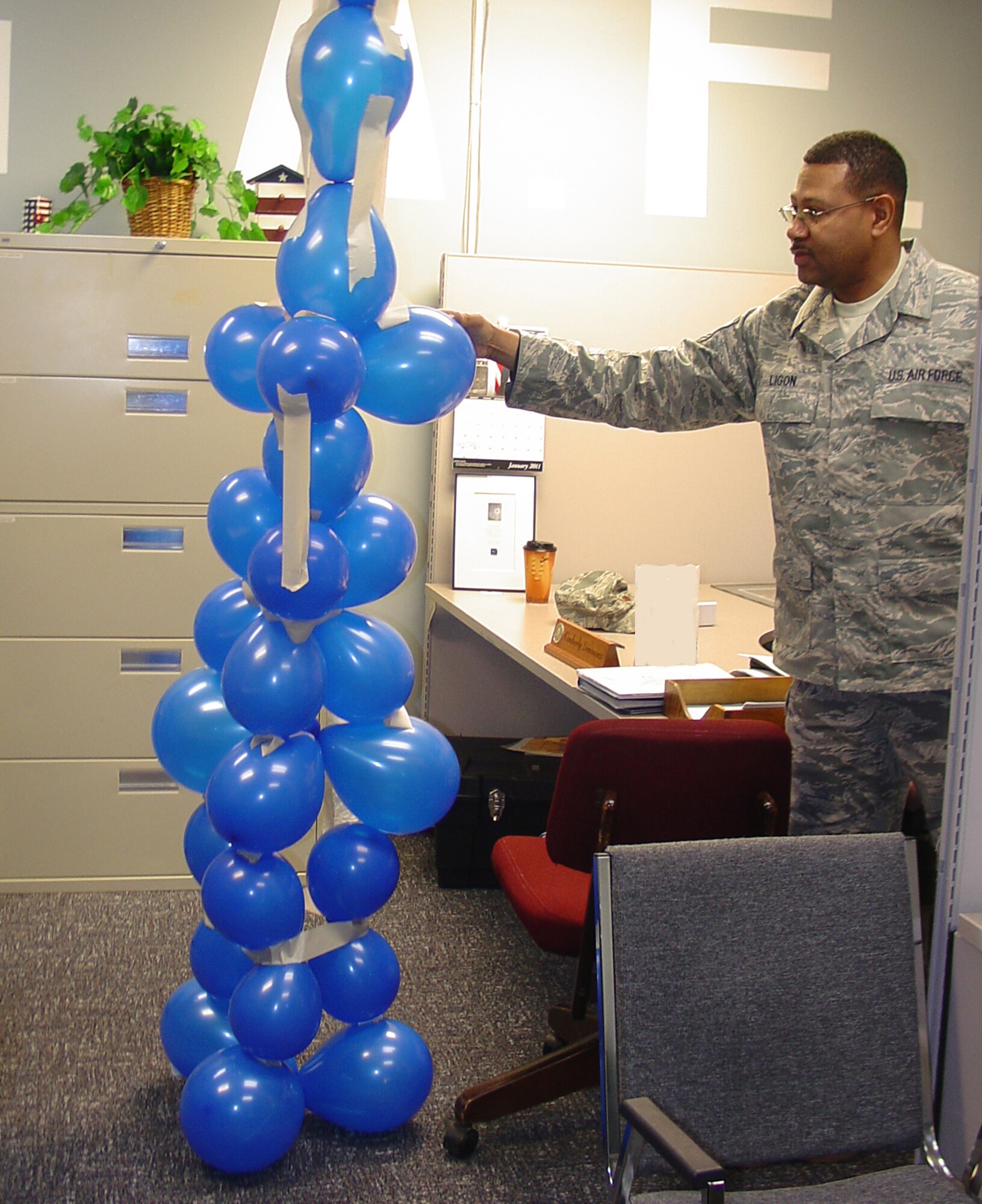 WRIGHT-PATTERSON AIR FORCE BASE, Ohio – Master Sgt. Allen Ligon, 445th Aeromedical Staging Squadron, participates in a teambuilding activity during his unit’s wingman stand down day Feb. 13. The stand down was part of a mandatory Air Force active duty and Reserves requirement to cover specific topics such as suicide prevention, resiliency and improving wingman skills.  (U.S. Air Force photo/Maj. Mary Reed)