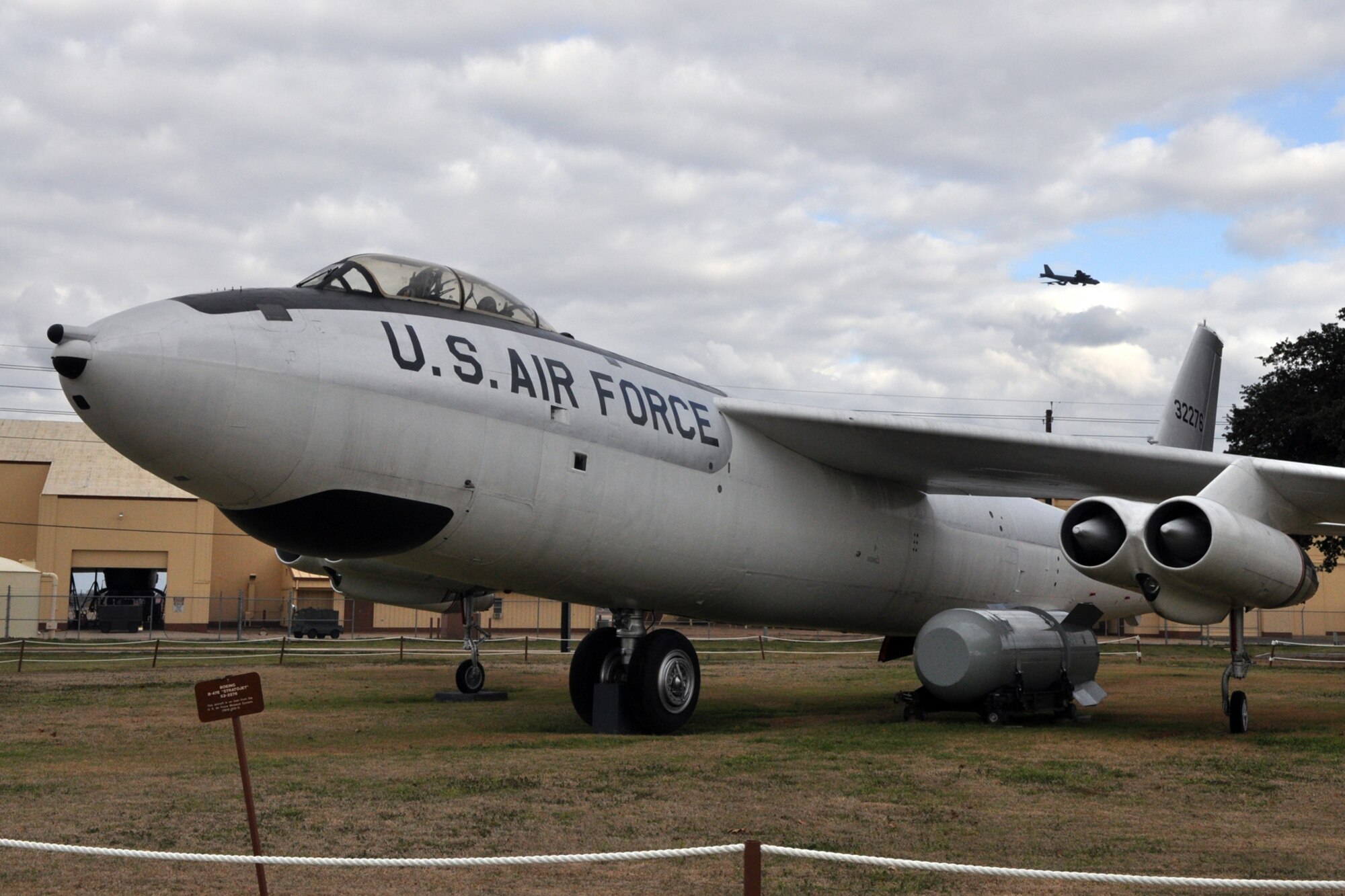 A B-52 Stratofortress flies behind a static display at the 8th Air Force Museum on Barksdale Air Force Base, La., Feb. 16, 2011. The museum is open to the general public and has a gift shop. It is accessible via North Gate Road in Bossier City, La. For more information contact the museum at (318) 752-0055. (U.S. Air Force photo/Tech. Sgt. Jeff Walston)