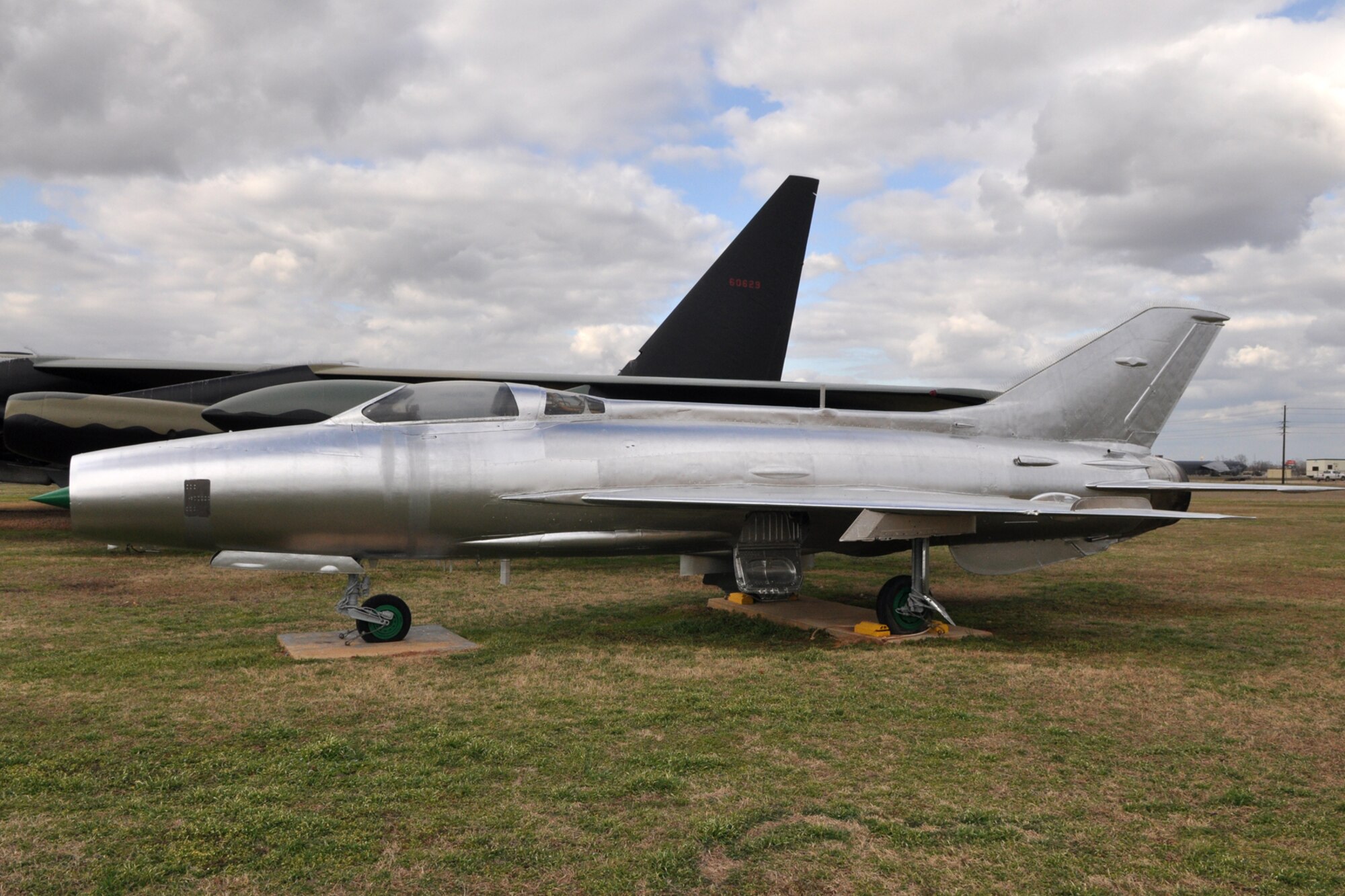 A MiG-21F sits on display as part of the 8th Air Force Museum at Barksdale Air Force Base, La., Feb. 16, 2011. The short-range day fighter-interceptor was the first major production version of the popular MiG-21 series. It is just one of many versions of this aircraft that has served in the arsenals of many nations around the world. The E-5 prototype of the MiG-21 was first flown in 1955. During the Vietnam War, MiG-21s were often used against U.S. aircraft. This particular aircraft has an unknown history. It was acquired by the USAF Museum for display at the 8th AF Museum at Barksdale. (U.S. Air Force photo/Tech. Sgt. Jeff Walston)