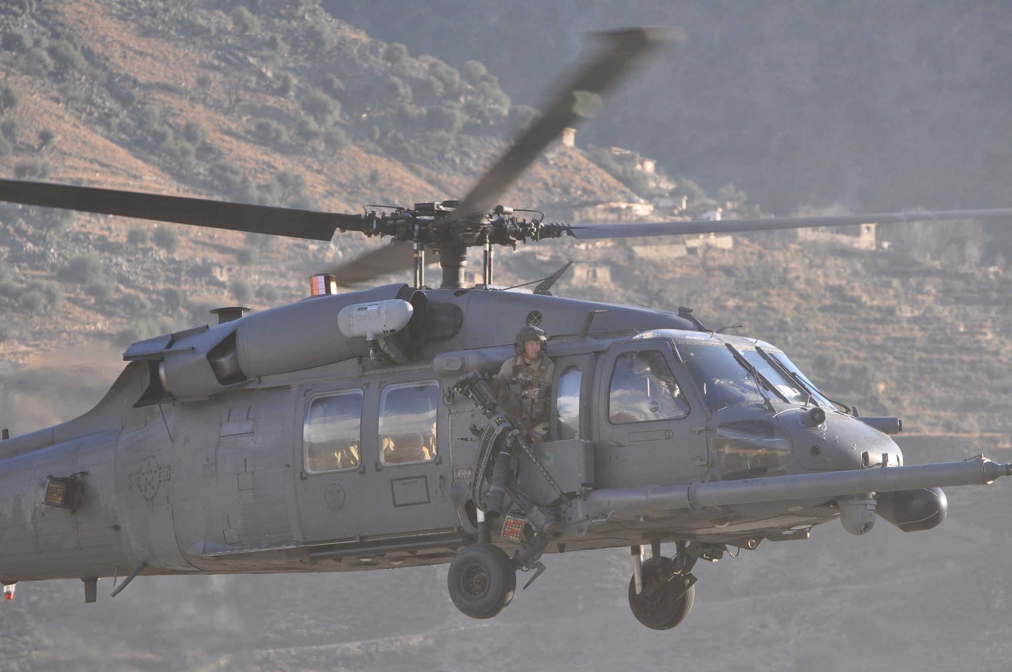 An HH-60G Pave Hawk assigned to Bagram Airfield's 83rd Expeditionary Rescue Squadron arrives at a remote forward operating base in Afghanistan's Kunar province.  The squadron occasionally repositions personnel and aircraft to forward operating bases to provide casualty evacuation support to planned ground operations.  (U.S. Air Force photo/Capt. Erick Saks)