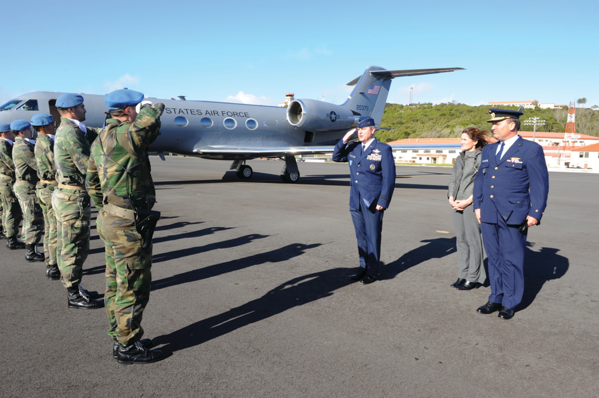 Gen. Mark A. Welsh III, U.S. Air Forces in Europe commander, returns the salute of Portuguese airmen on his arrival to Lajes Field, Azores, Feb. 15, 2011.  Airmen of the 65th Air Base Wing hosted the USAFE commander, Chief Master Sgt. David Williamson, USAFE command chief, and their spouses during a two-day visit. (Photo by Guido Melo)